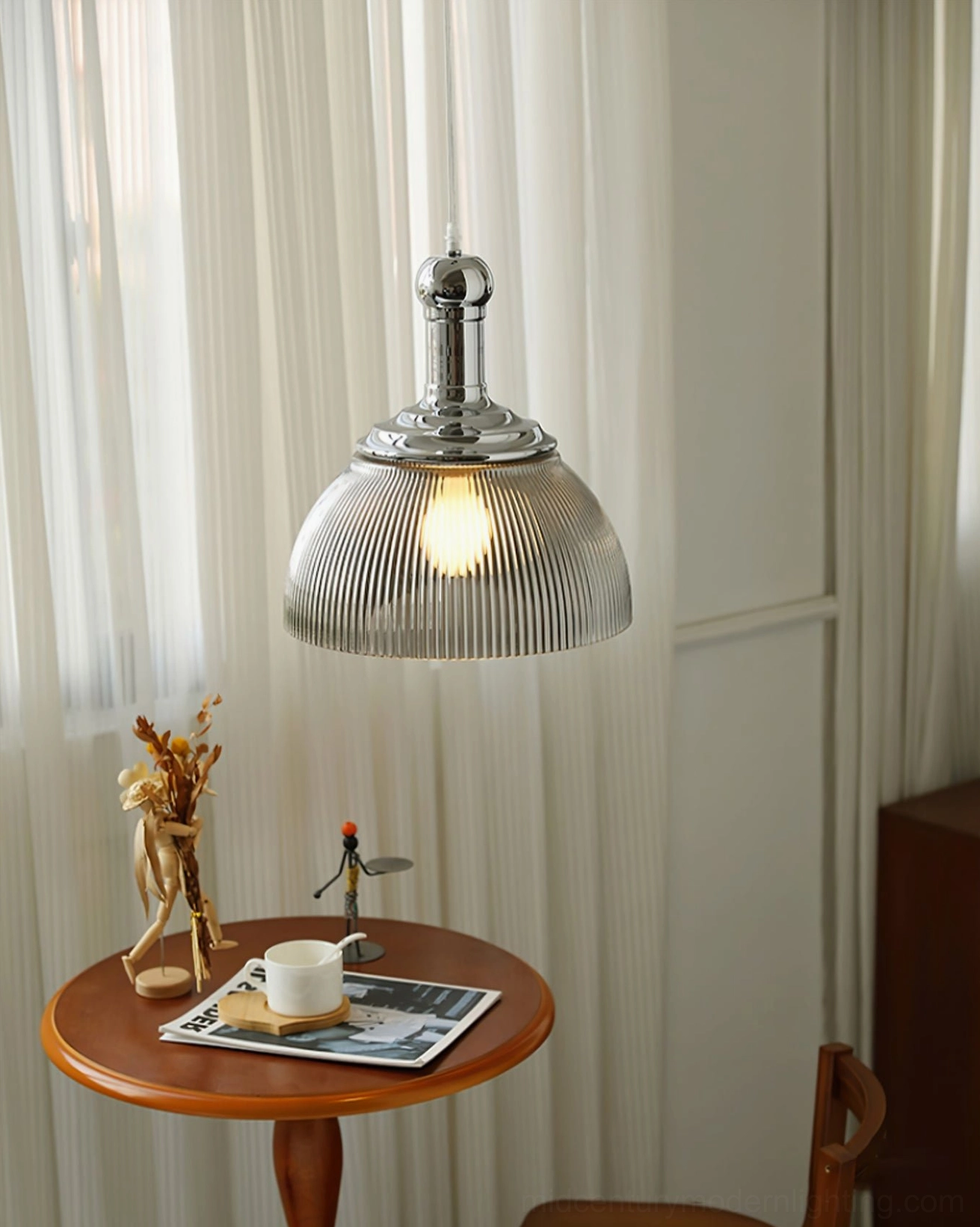 Ribbed glass pendant fixture showing chrome metal mounting hardware and ceiling installation detail