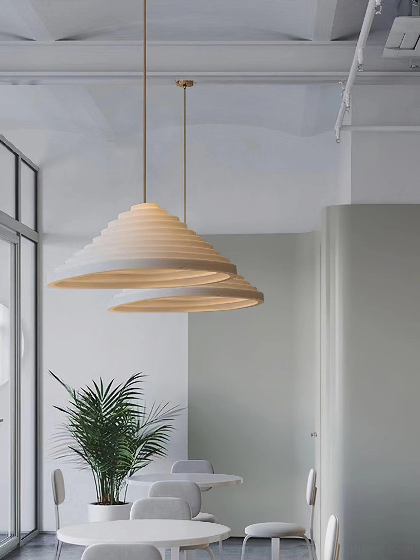 Two stacked Rice Field acoustic tapered pendants in minimalist modern café shop interior with warm ambient lighting