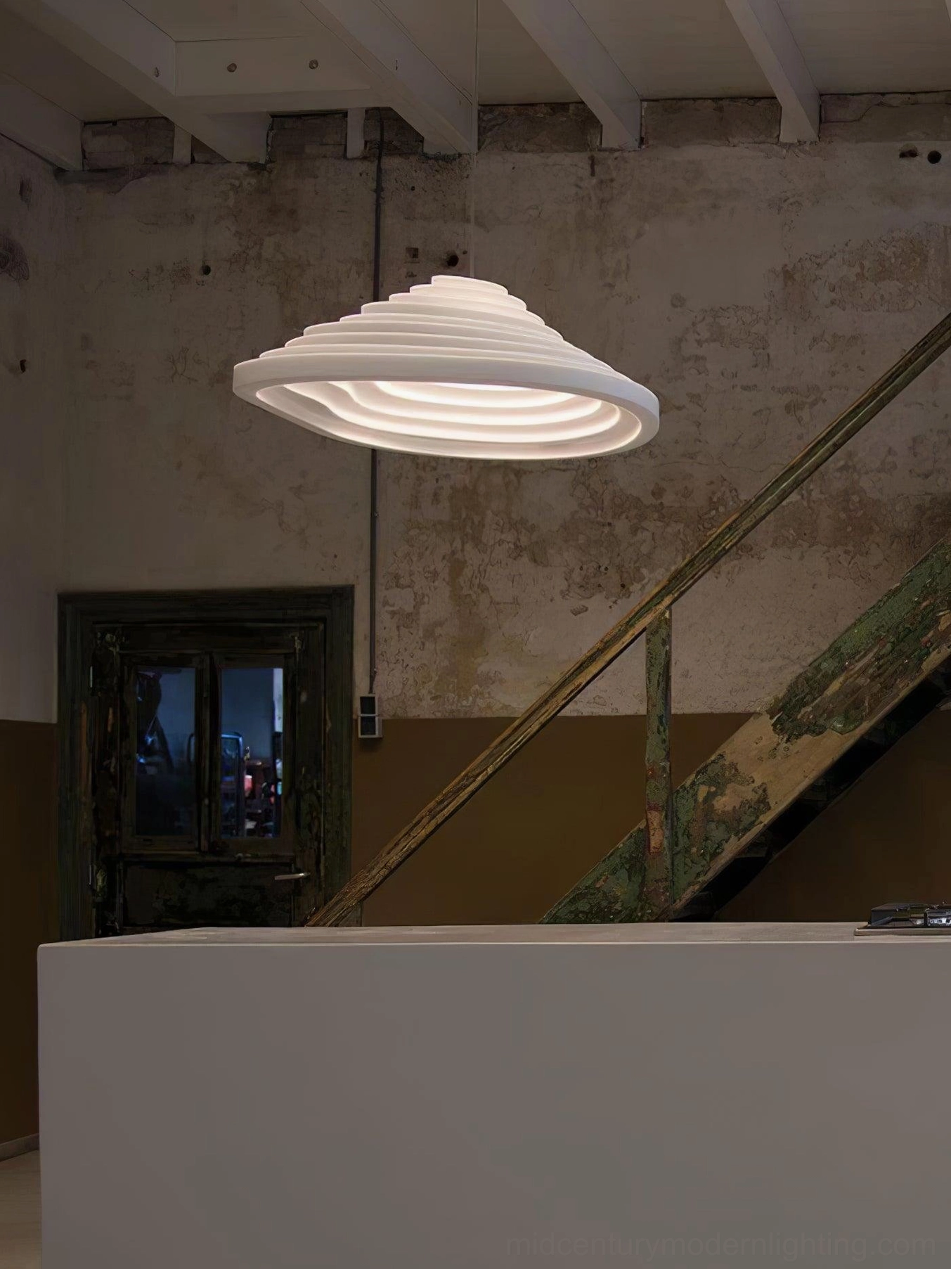 Rice Field Acoustic Tapered Pendant in industrial home entryway - off-white ribbed design with warm glow low angle view