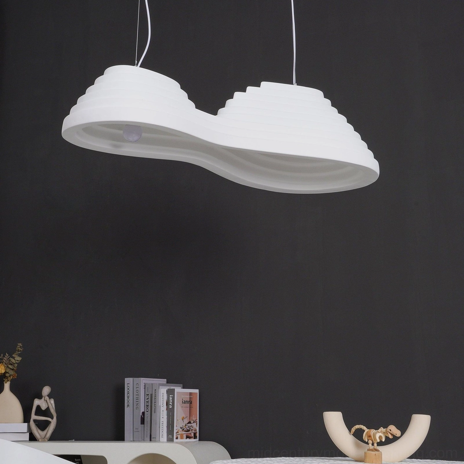 Sculptural rice field inspired pendant lamp detail showing matte finish and flowing contour design