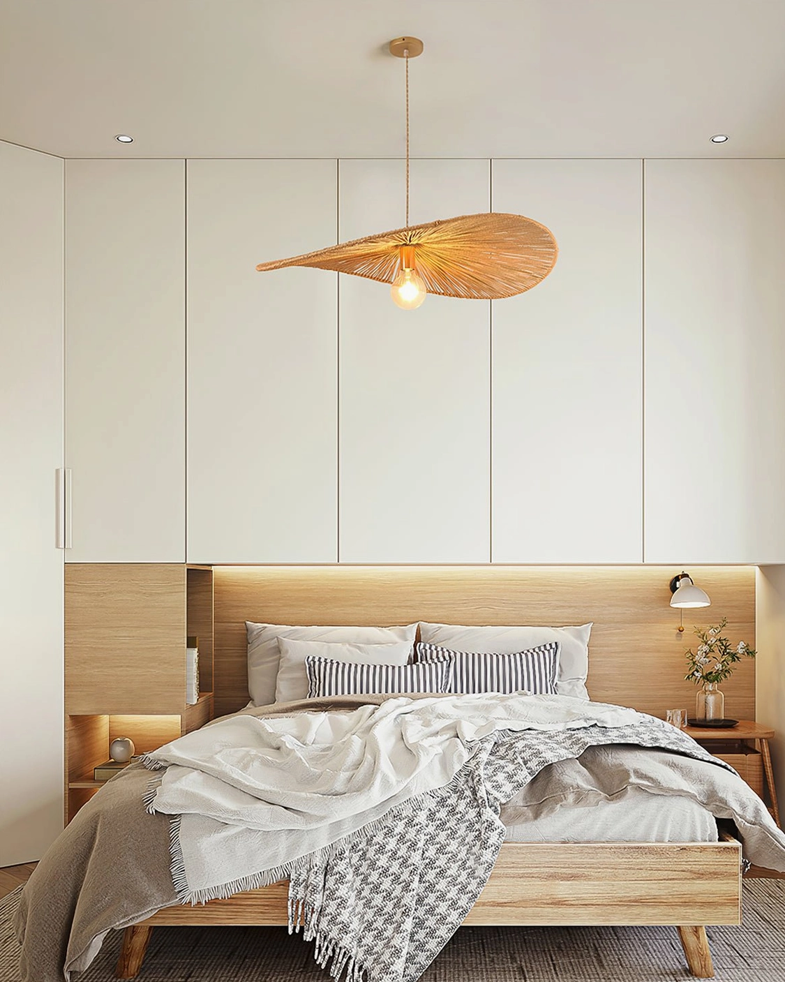 Ridotti oversized rattan pendant lamp above sofa in minimalist modern living room showcasing leaf-shaped shade design