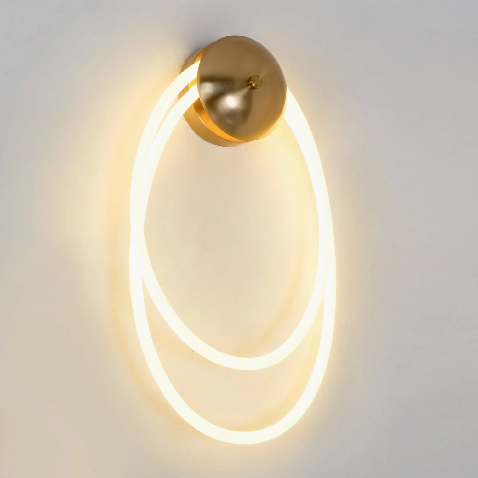 Rigel contemporary rope light fixture side view with illuminated warm yellow light and brass gold mount