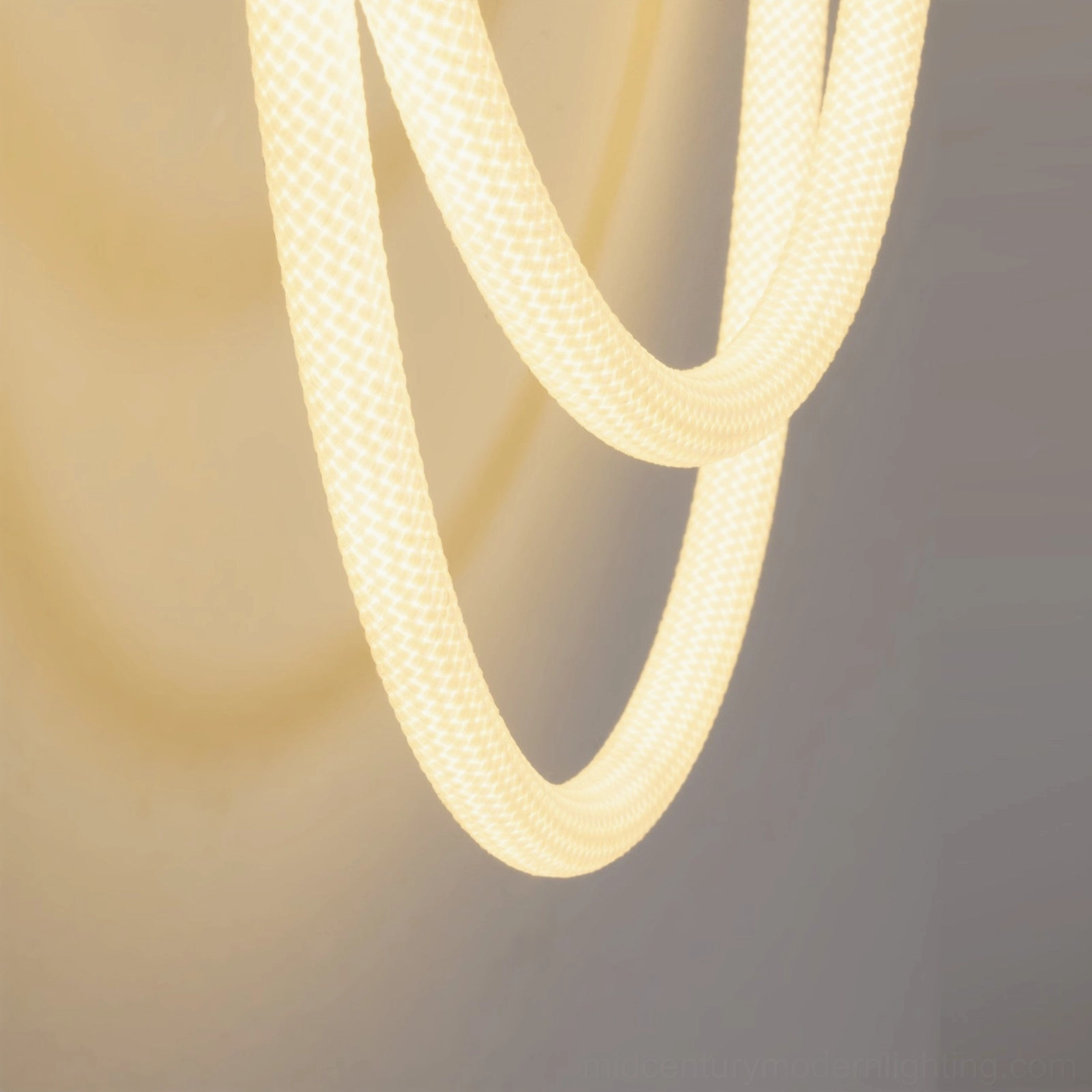 Rigel wall lamp close-up macro view showing woven textured rope with integrated warm LED core