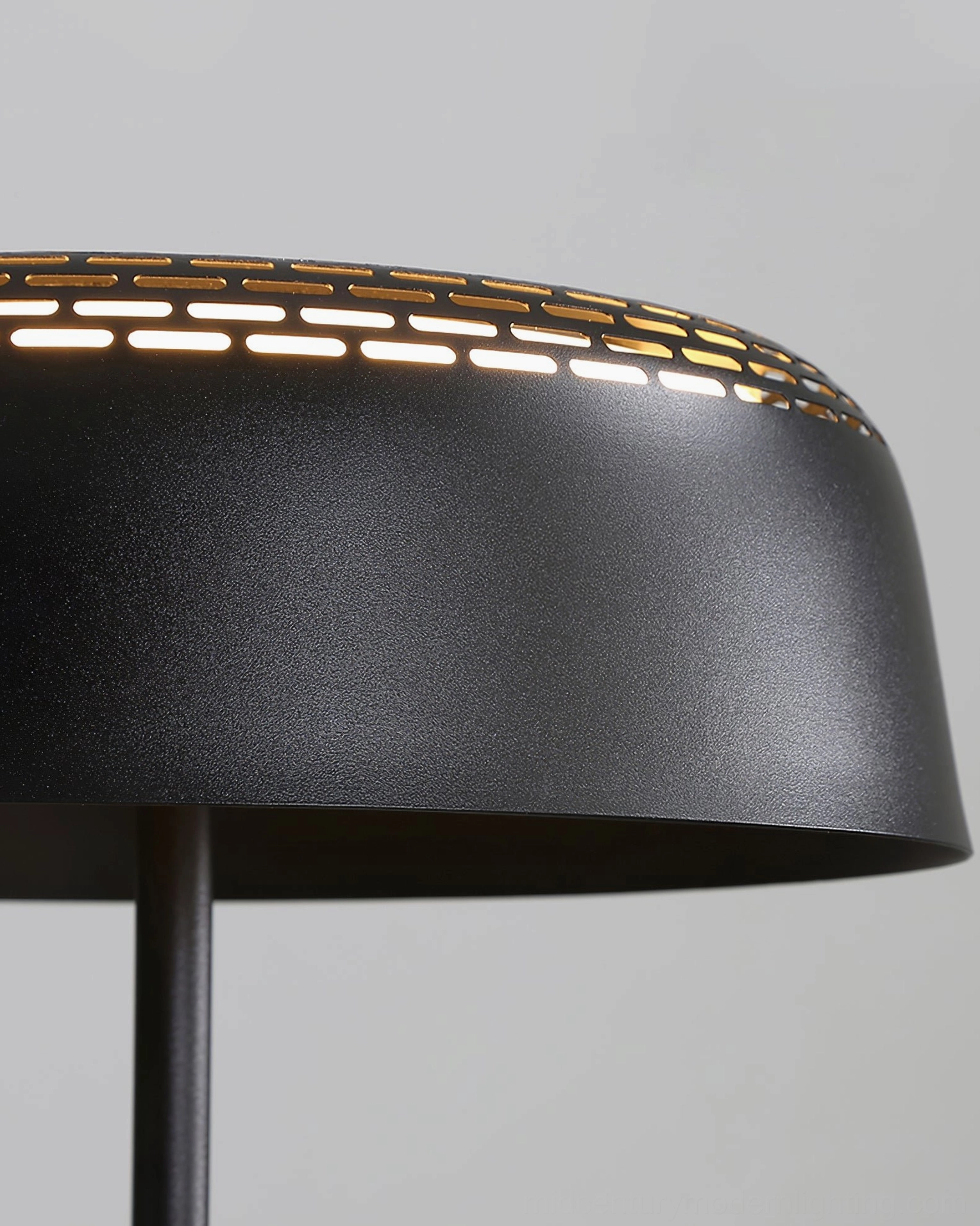 Ring T1 modern black table lamp with side perspective view on wooden bedroom furniture