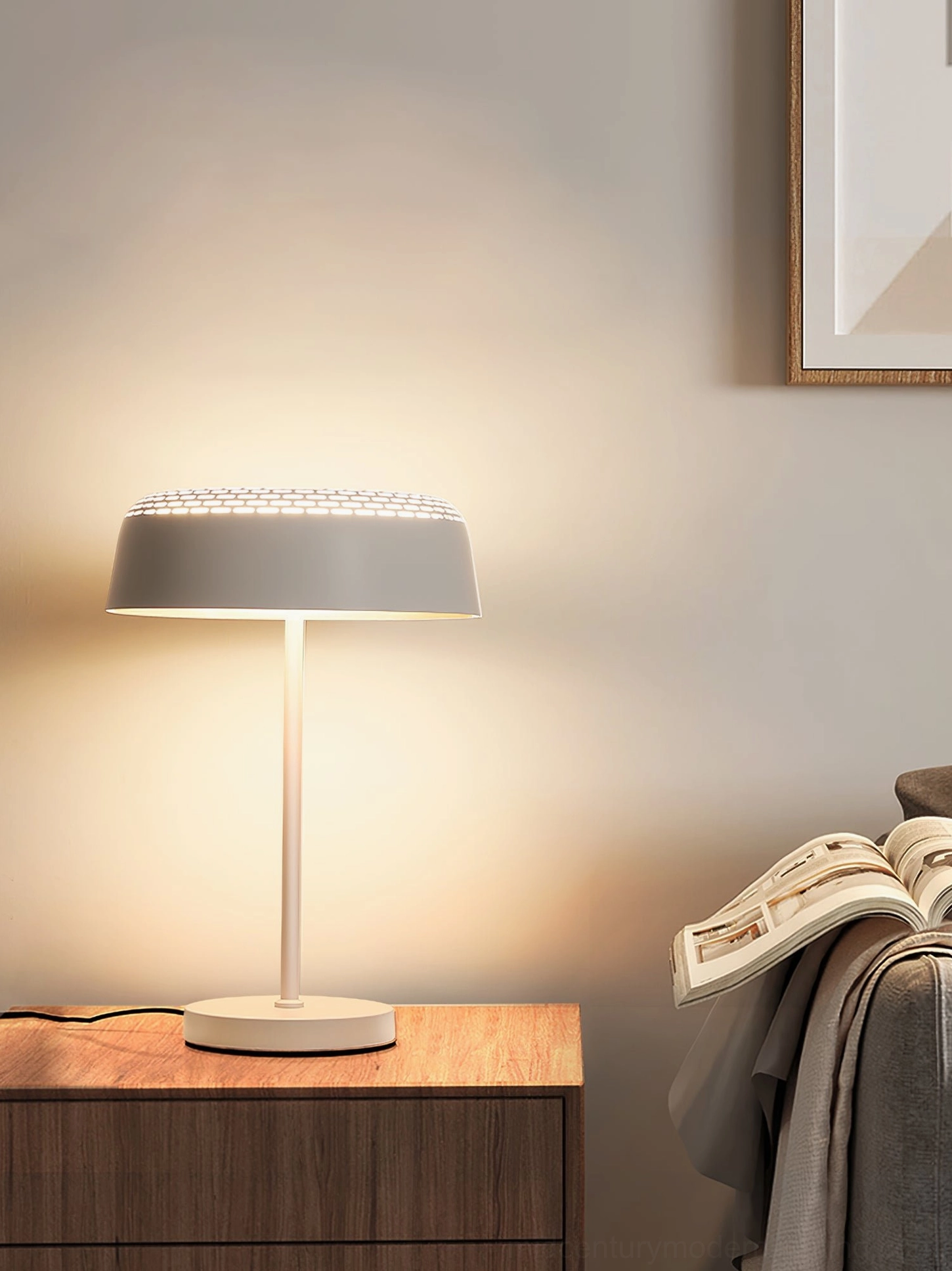 Ring T1 white minimalist table lamp creating ambient glow in cozy bedroom reading nook