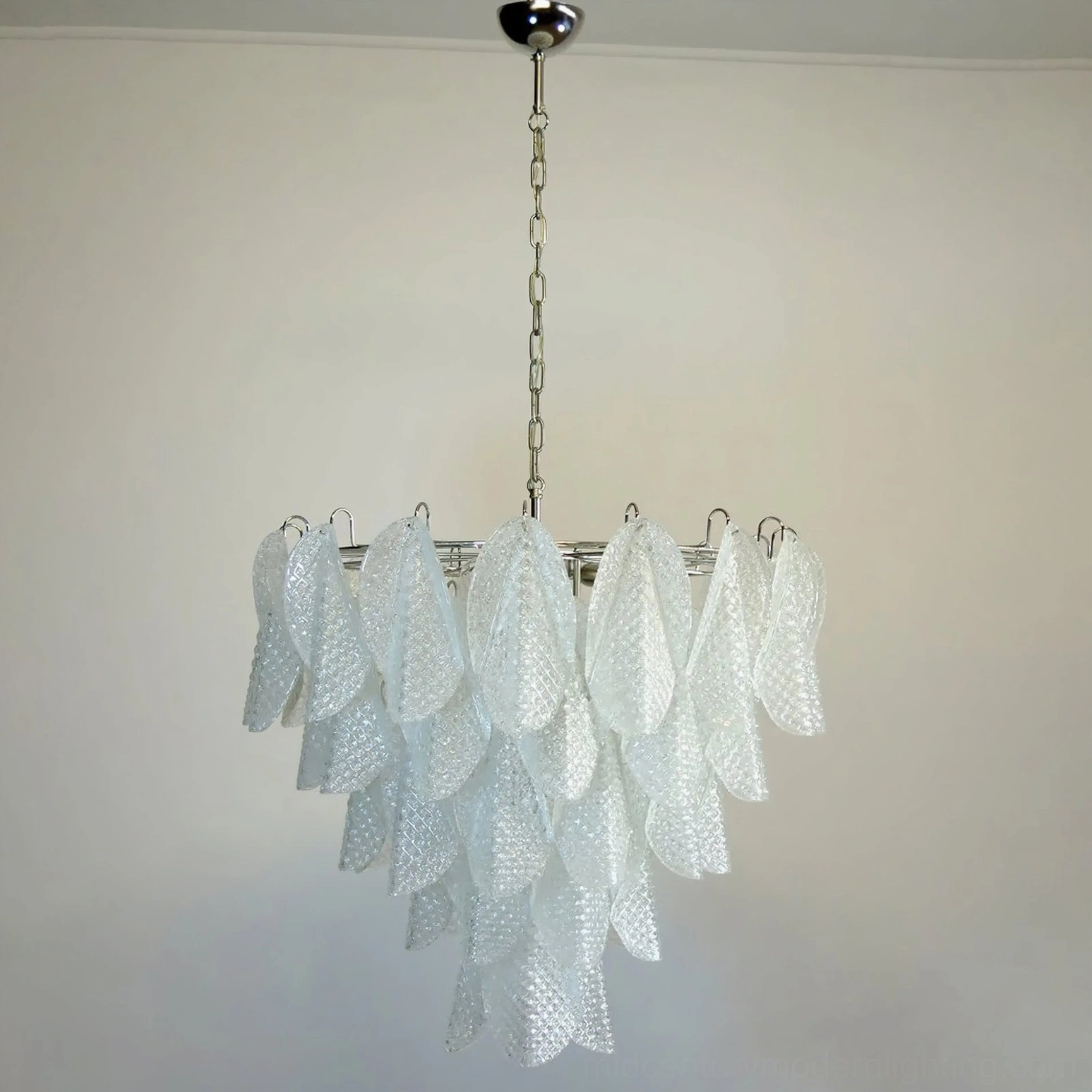 Bottom view of ripple glass chandelier displaying glass petal arrangement and light distribution pattern