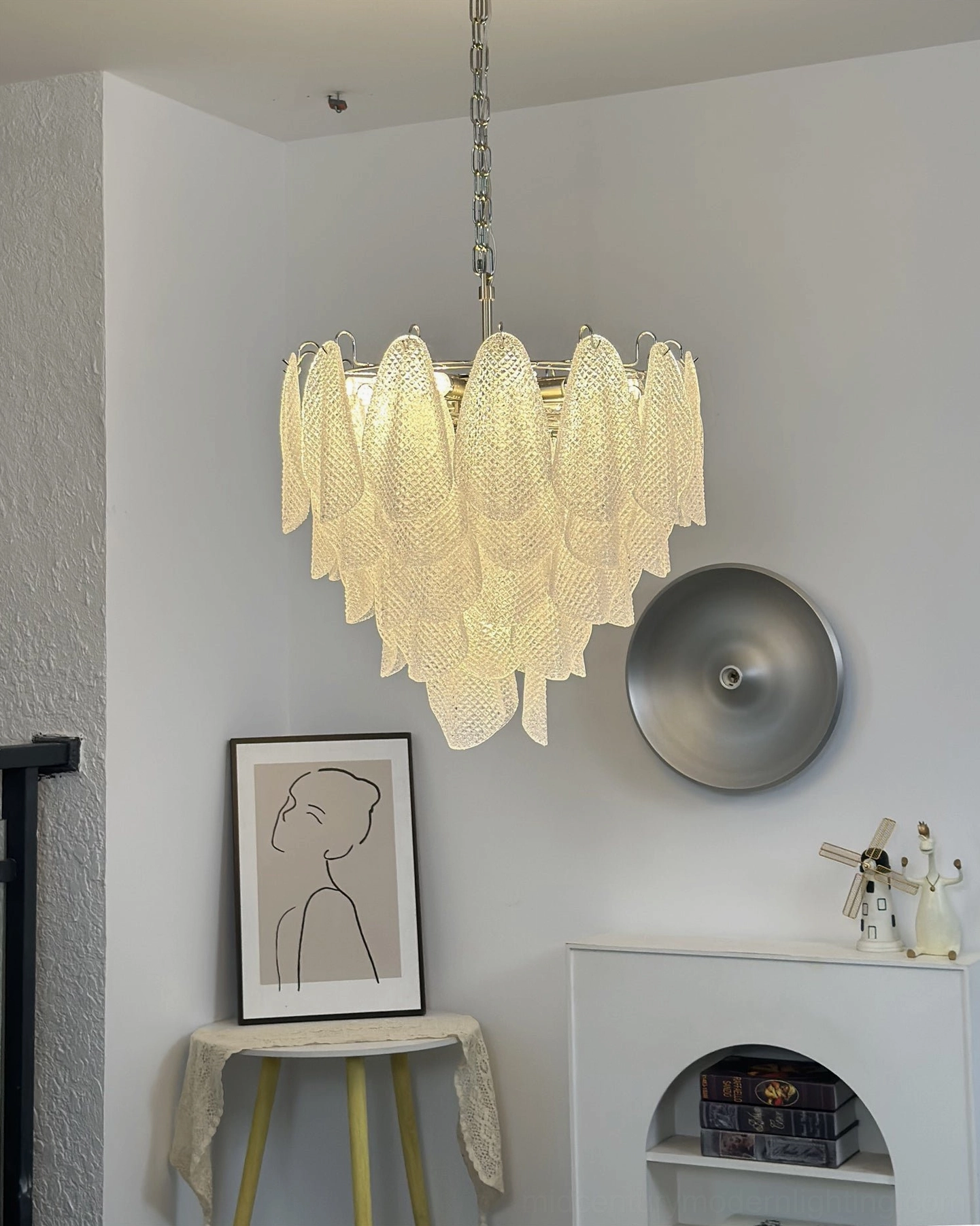 Ripple glass chandelier installation view showing ceiling mount and hanging suspension hardware
