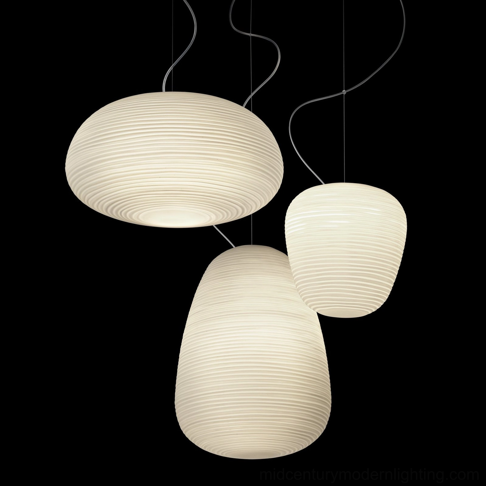 Three Rituals pendant lights different shapes sizes low angle dark studio collection showcase
