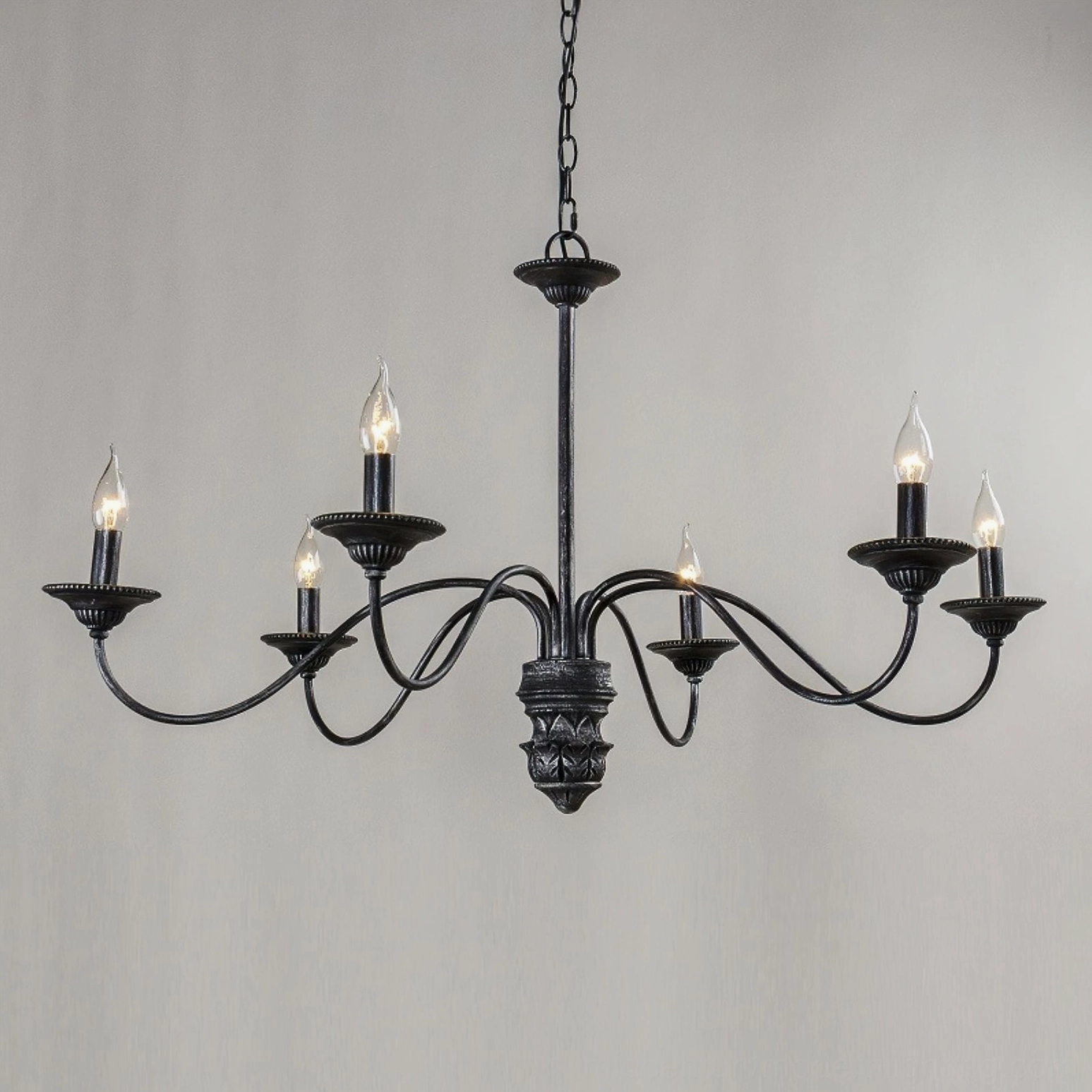 Rohan 6-light vintage black chandelier three-quarter angle showing ornate carved central column and candle-style lights