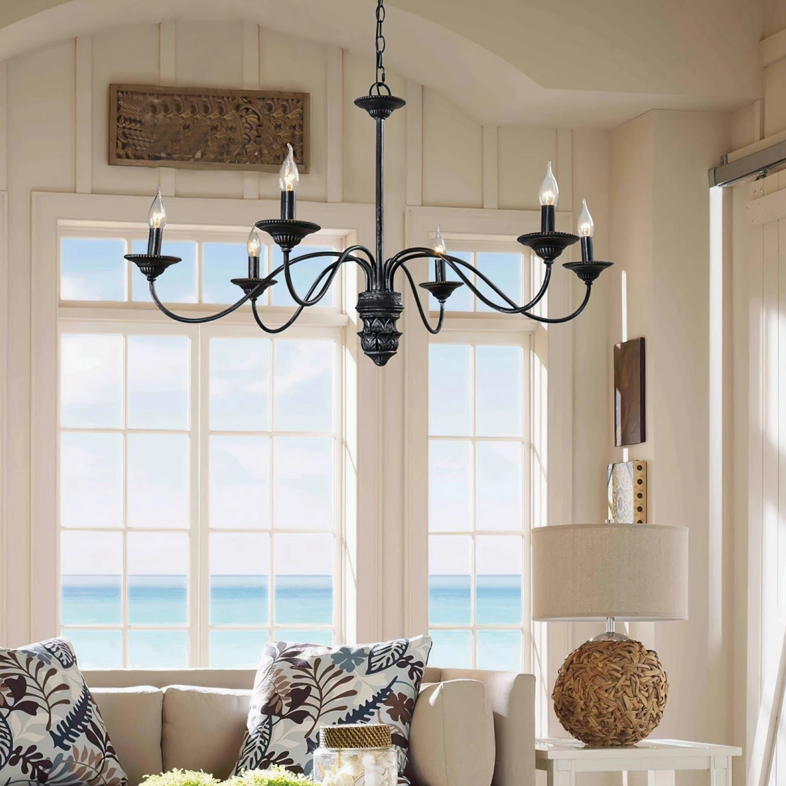 Rohan black vintage chandelier interior room view with coastal living room decor and ocean view windows neutral palette