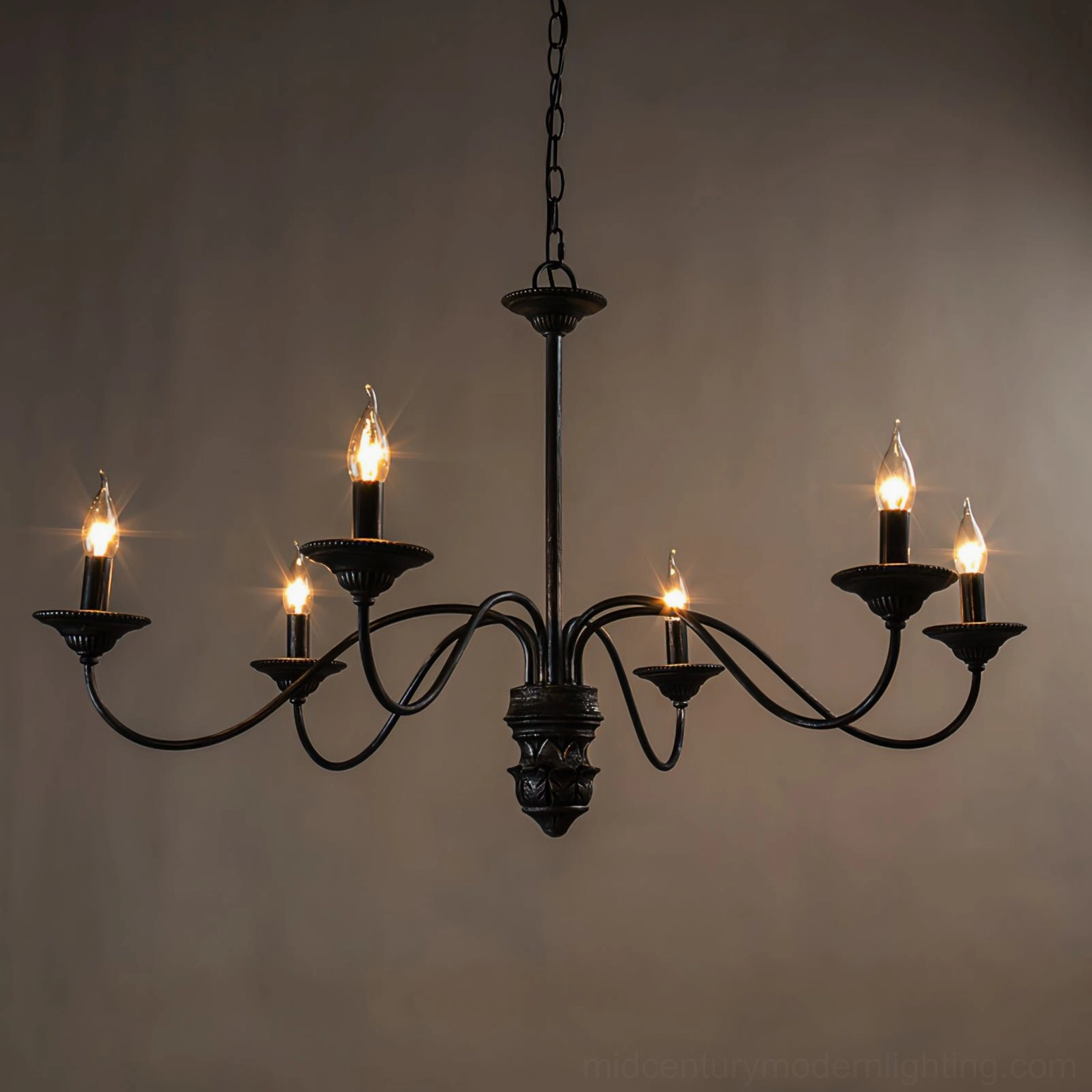 Rohan black distressed metal chandelier showing complete ornamental construction and arm design details
