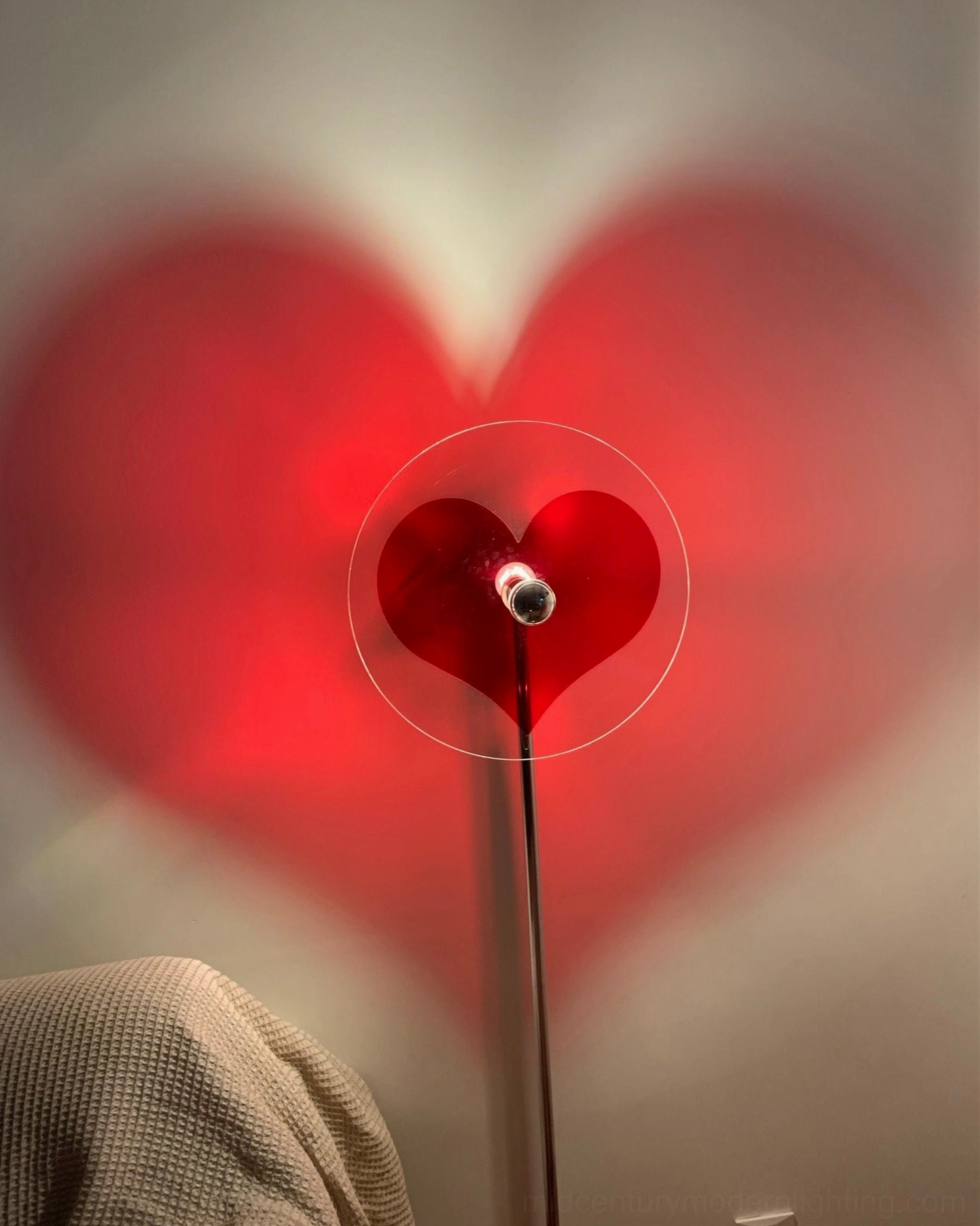 Heart shadow projection floor lamp showcasing romantic modern lighting design for home interiors