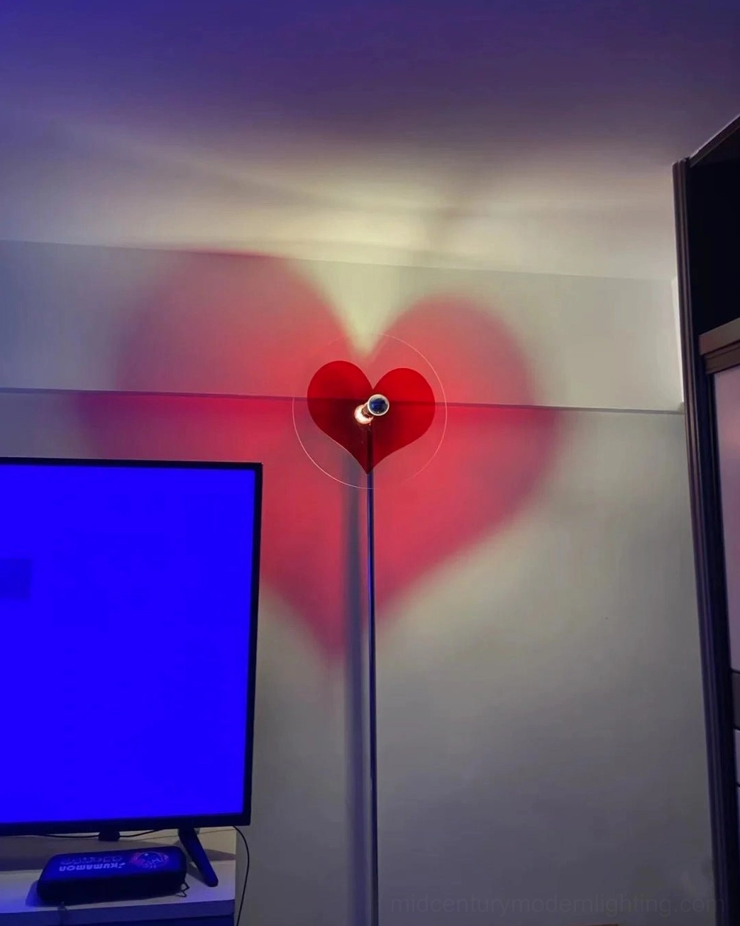 Red heart projection floor lamp combining modern design with romantic emotional expression