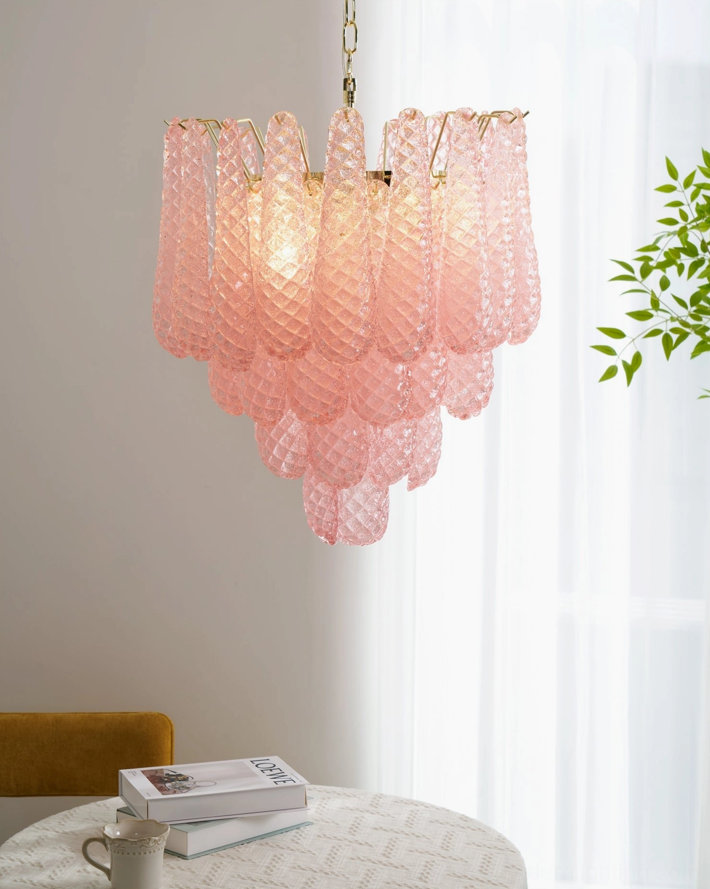 Romantic pink hand-blown glass chandelier featuring organic teardrop forms and gold finish