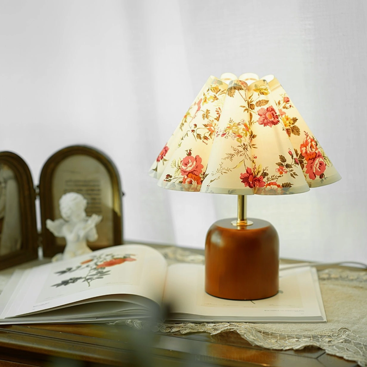 Vintage floral table lamp front close-up on dresser tabletop with warm-toned coordinated decor