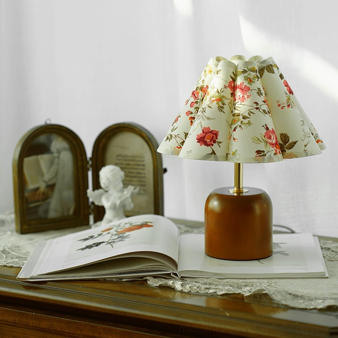 Mid-century modern table lamp on vintage dresser with lace doily and decorative accessories