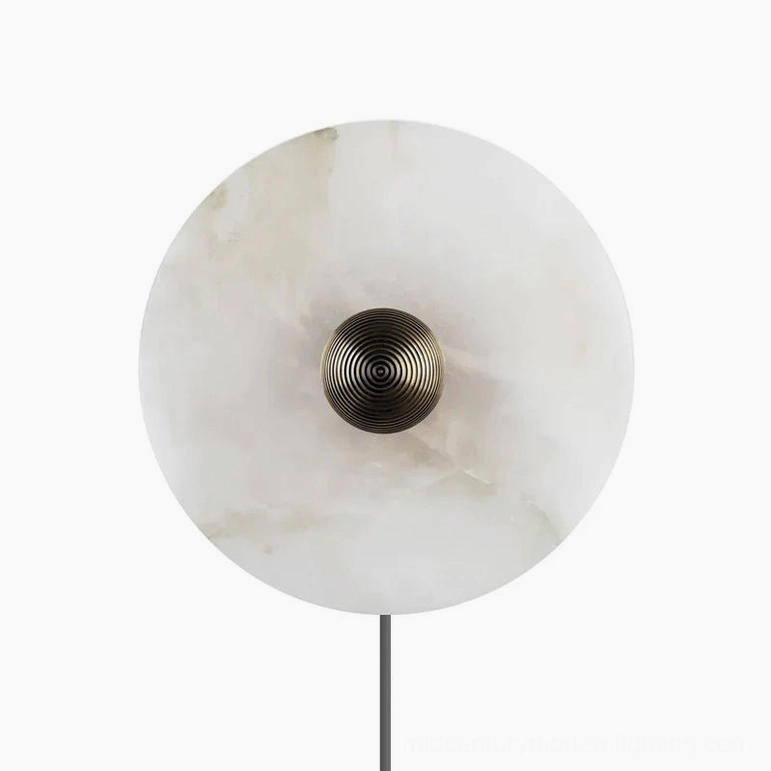 Round alabaster plug-in wall sconce with prominent ribbed bronze central fixture on white background