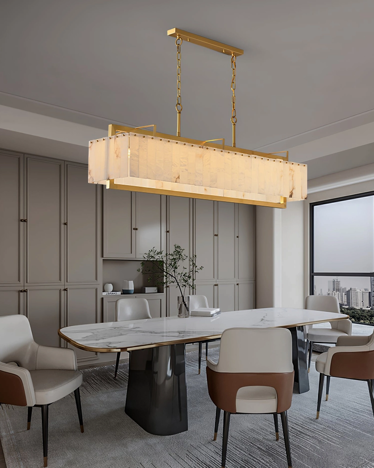 High-end modern kitchen dining area with Ruben Alabaster Chandelier above marble table - sleek luxury lighting