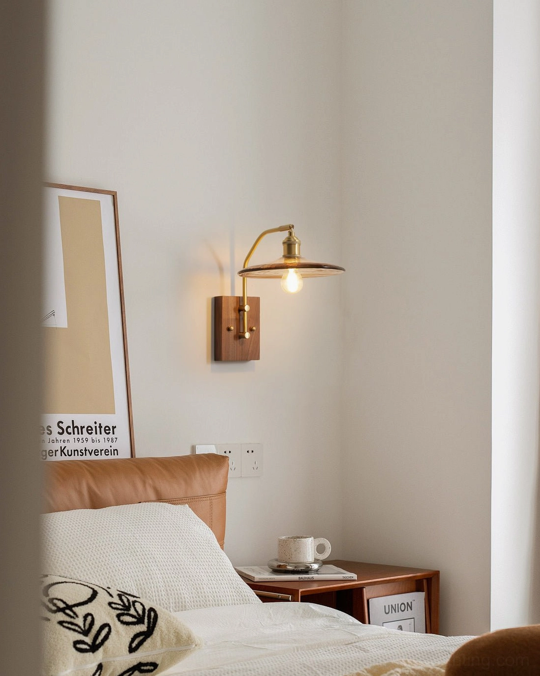 Runia mid-century wall light mounted in cozy bedroom with dark wood furniture, Nordic retro home decor style
