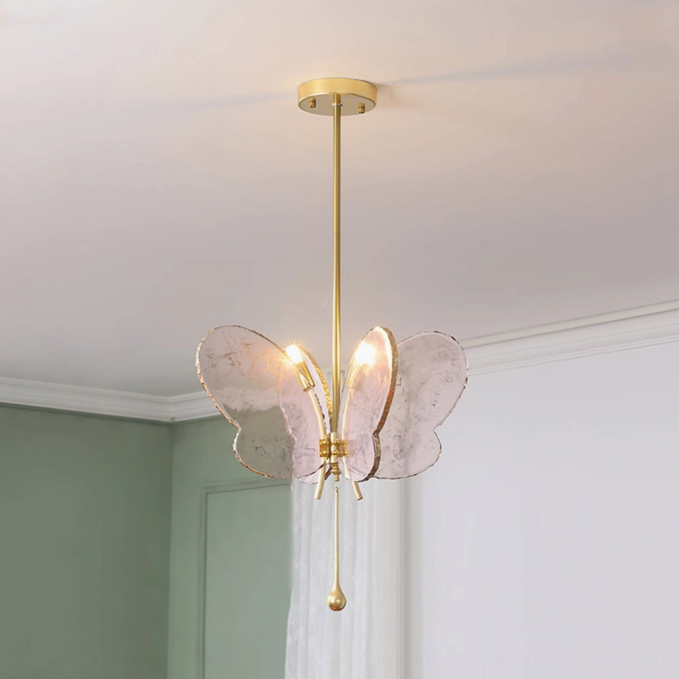Pink marbled butterfly pendant lamp overhead view in modern bedroom with green accent wall