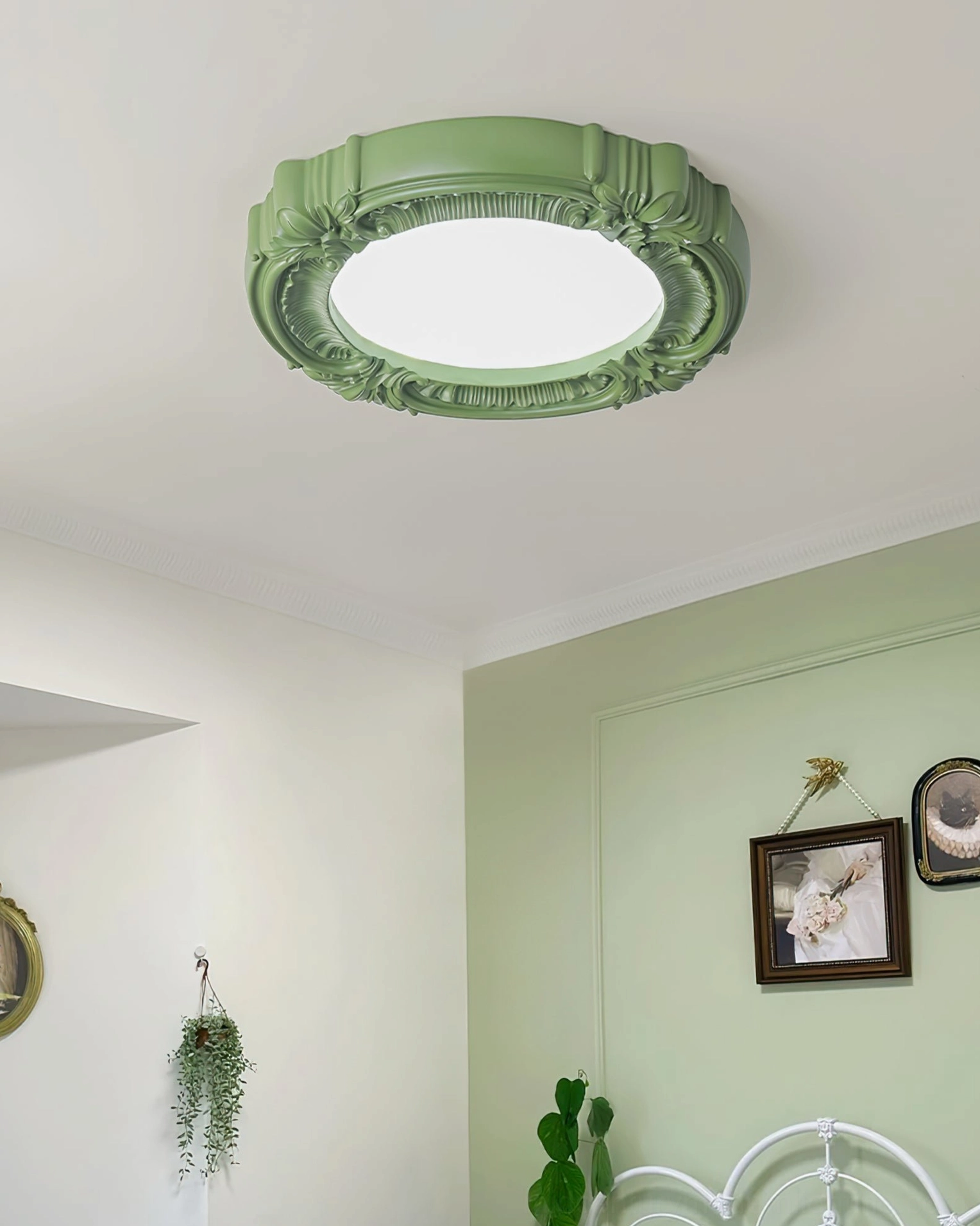 Sage green retro ceiling lamp flat lay styling with green accent wall bedroom background