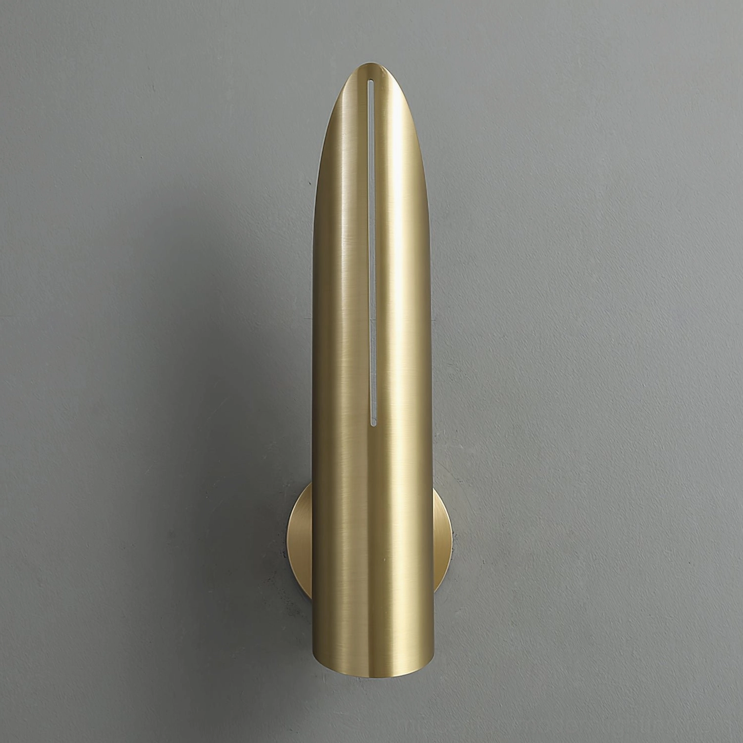 Salvatore brass bullet wall sconce sleek cylindrical modern metal lighting on grey background