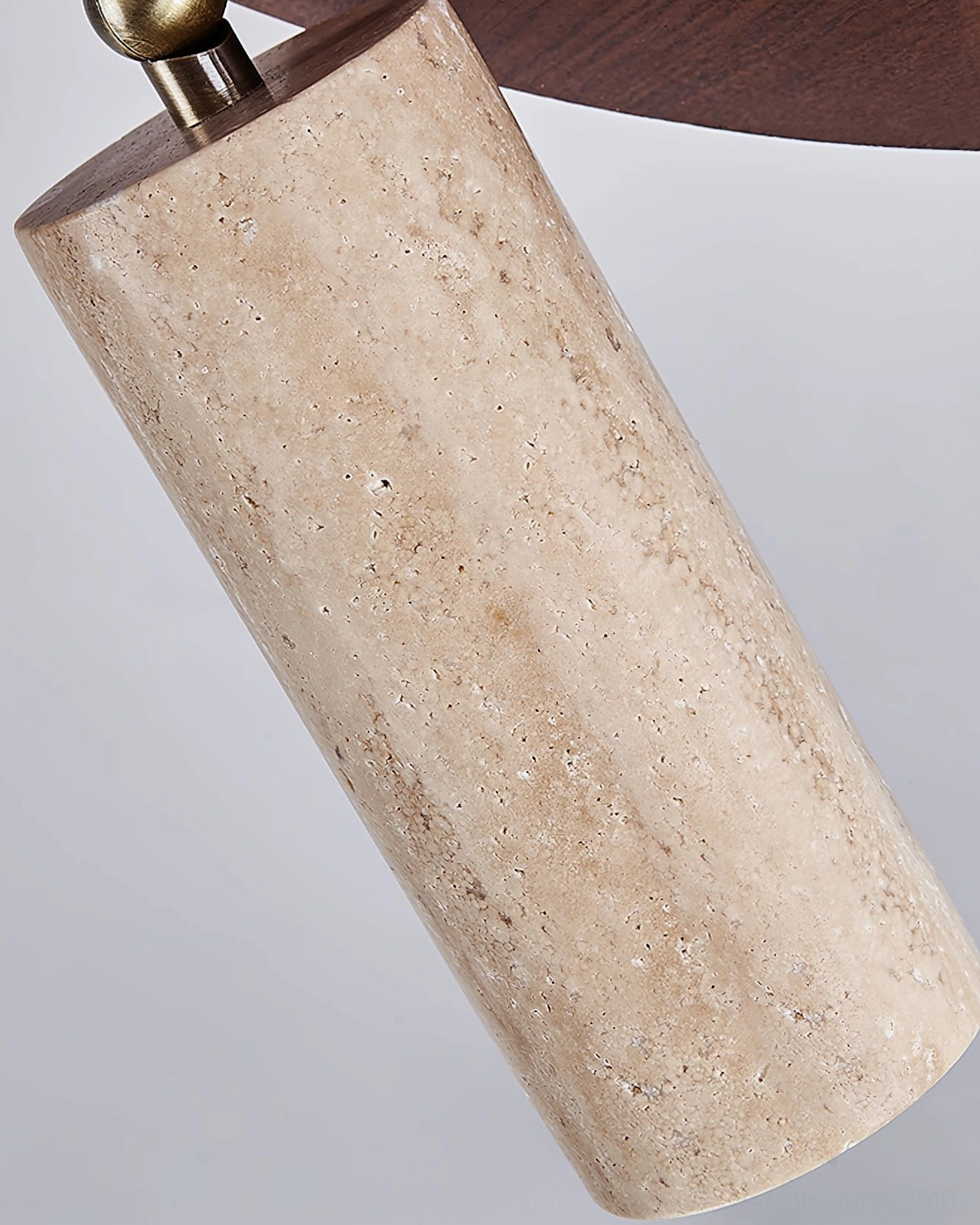 Close-up detail of Sandia travertine lamp head showing natural stone texture and metal mounting hardware