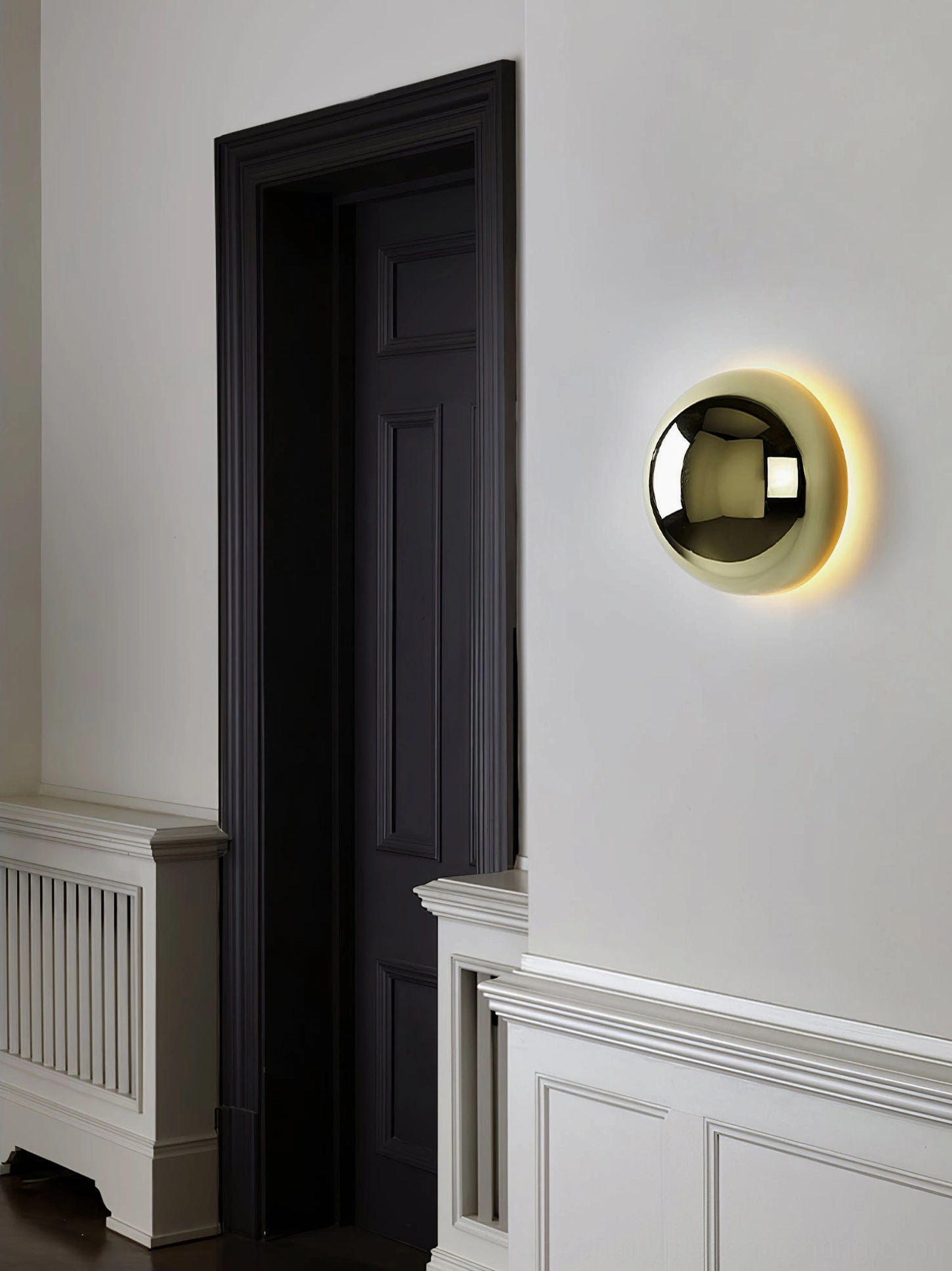 Chrome finish sphere wall sconce in Scandinavian minimalist interior design