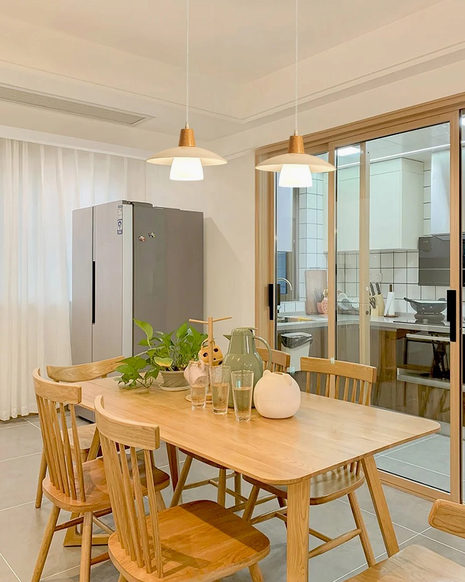 Scandinavian pendant light installed in modern living space with warm ambient lighting effect