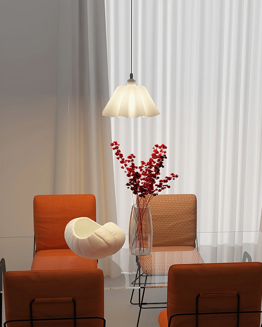 Scandinavian pleated pendant light in warm nordic dining room with red floral accents and glass table