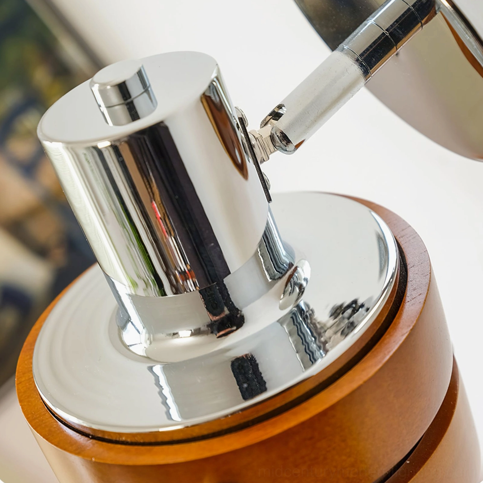 Close-up detail of mid-century wall sconce rivet fasteners and wood grain texture