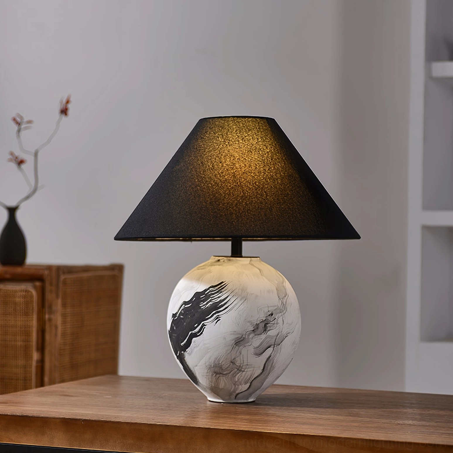 Modern ceramic table lamp with sculptural hand-painted base and neutral linen shade styling