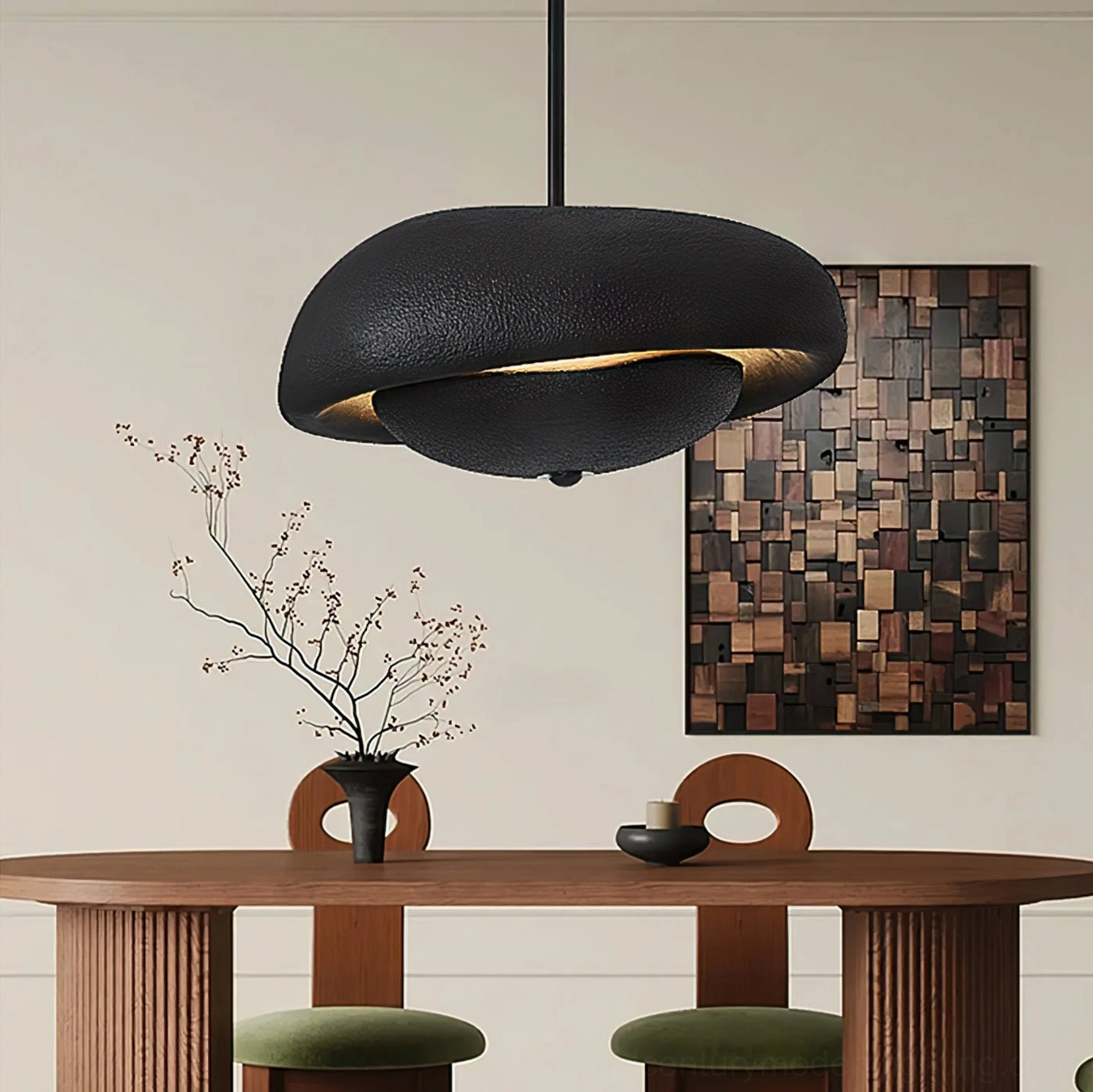 Organic resin pendant light fixture in matte black installed in residential dining area with warm ambient lighting