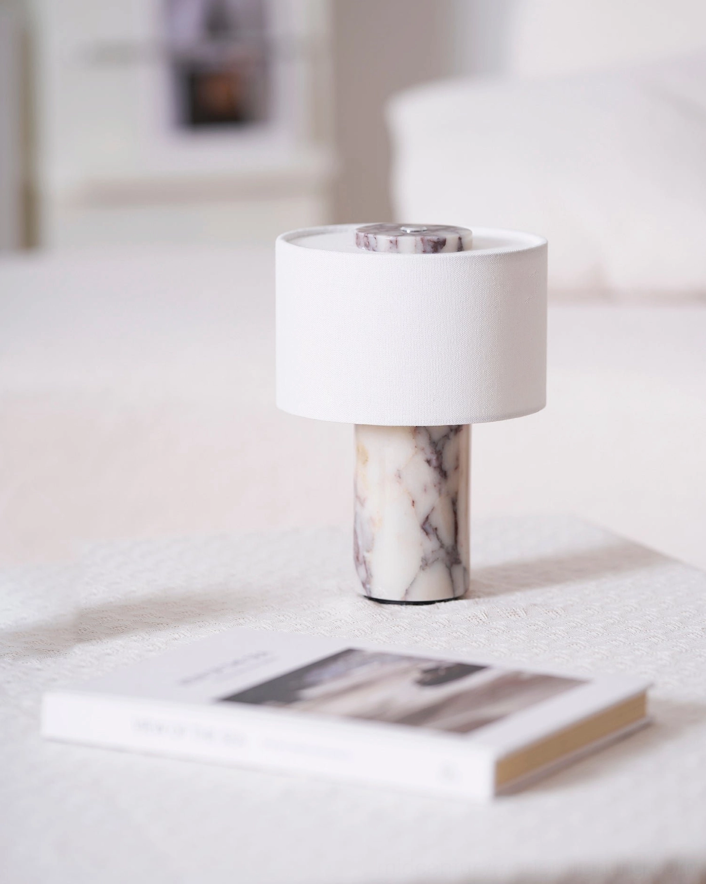 Bulgari red marble Sediment lamp with warm white ambient light in contemporary bedroom setting