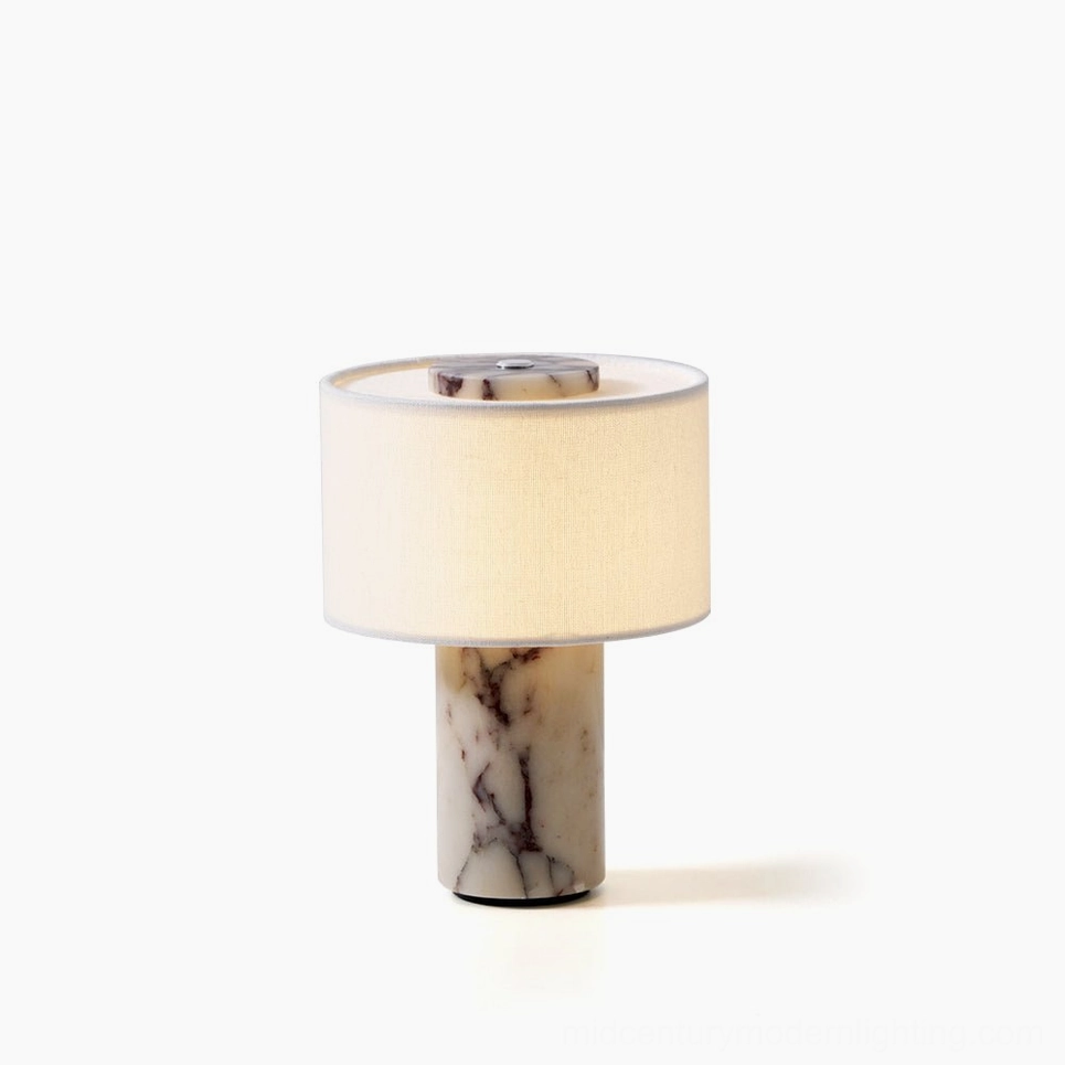 Sediment cordless marble table lamp with cylindrical natural stone base and white fabric drum shade, front view studio shot