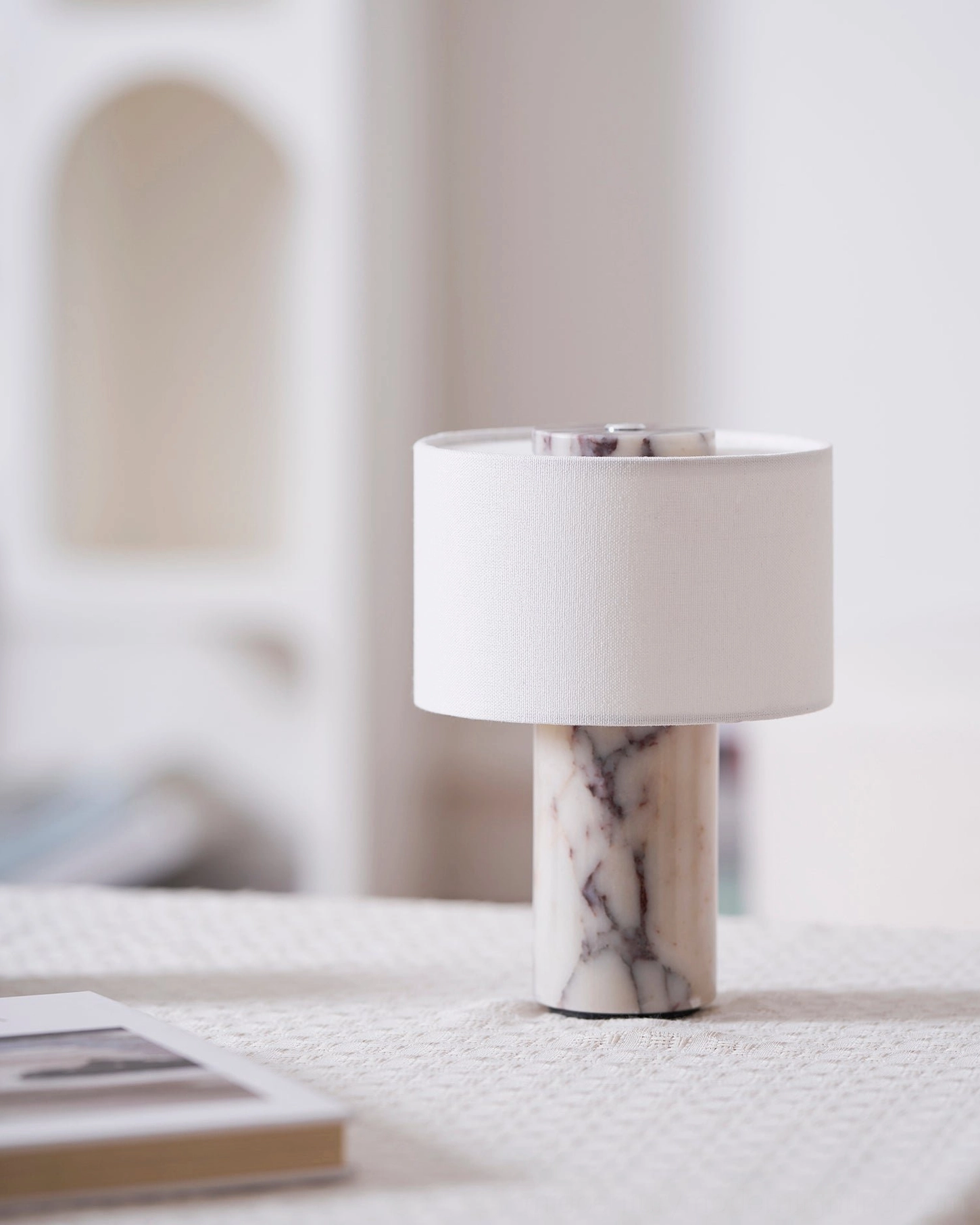 Sediment cordless marble table lamp on minimalist home side table with natural lighting