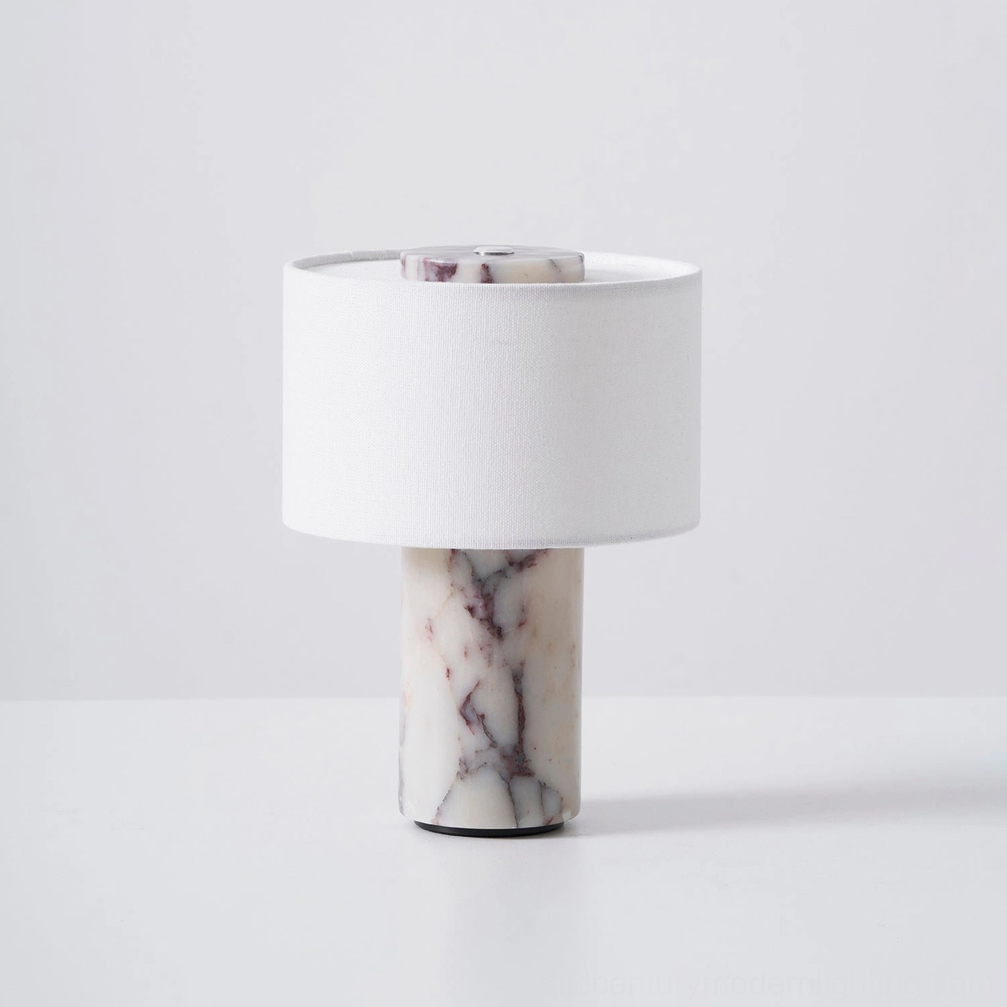 Close-up detail view of white fabric drum shade texture on cordless marble lamp