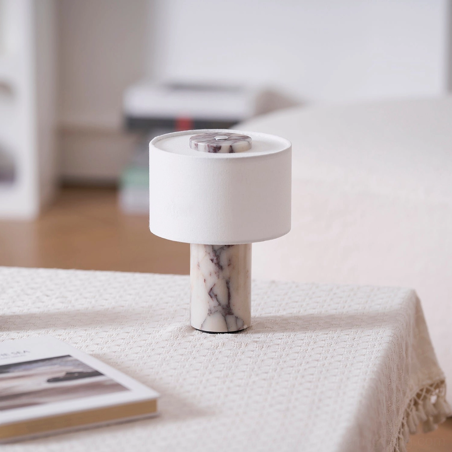 White marble Sediment table lamp with grey veining on light background, pure minimalist aesthetic