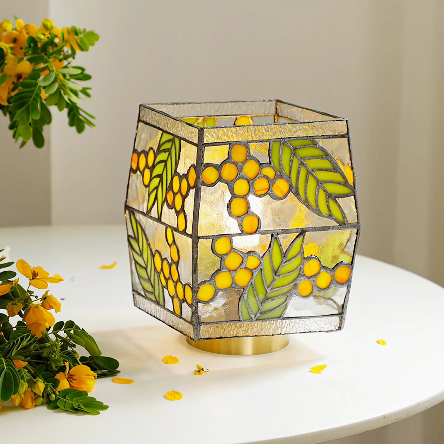 Seed Table Lamp front view with full leaf and berry glass design against floral decor background