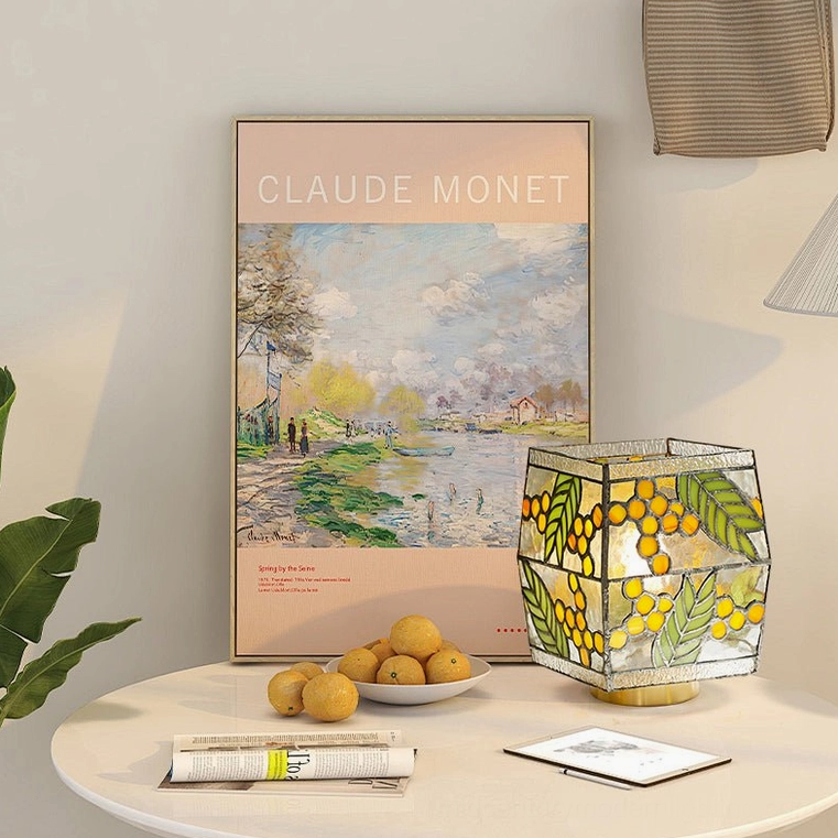 Seed Table Lamp three-quarter view on minimalist side table with Monet art print