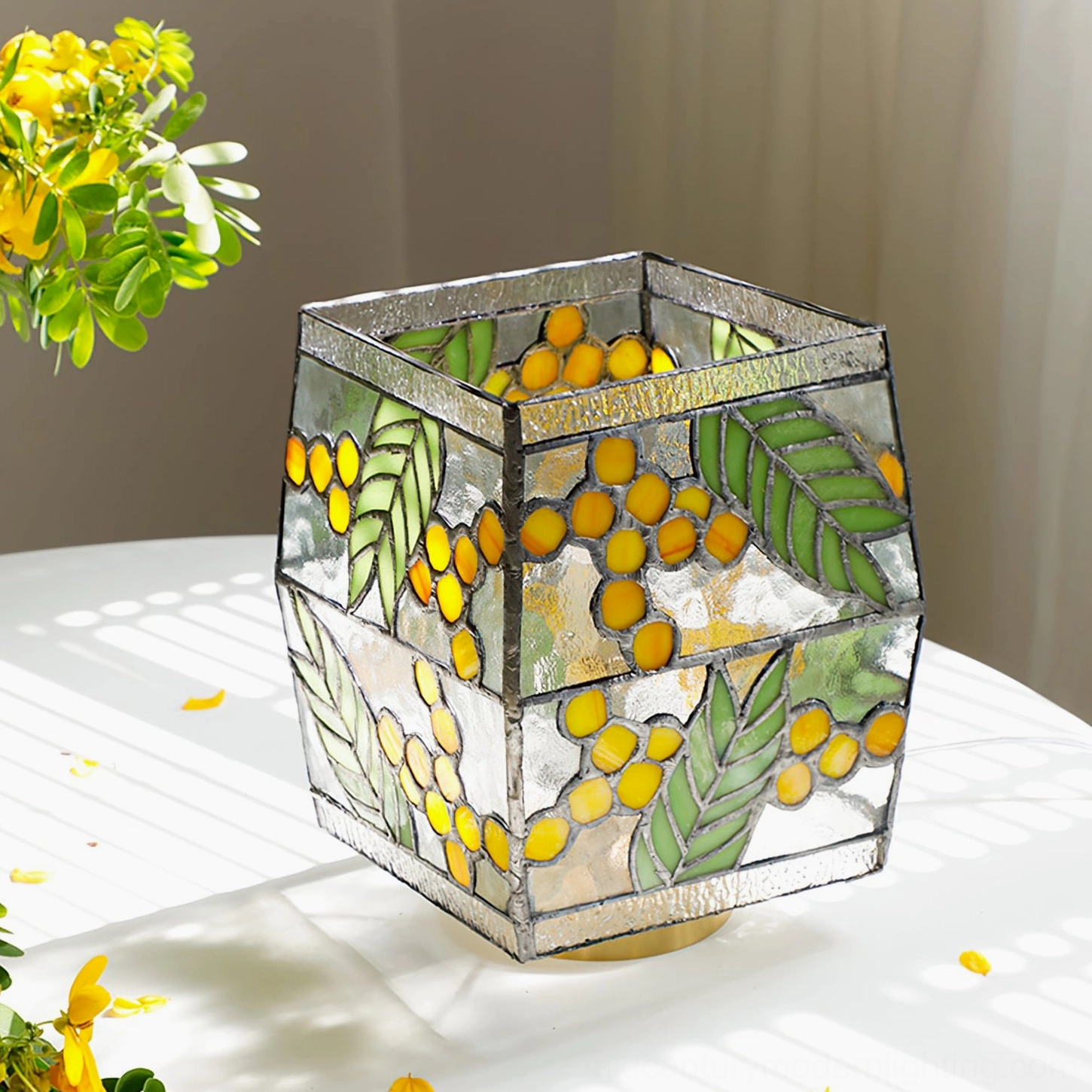 Seed Table Lamp high angle view with soft natural sunlight shadows on white table surface
