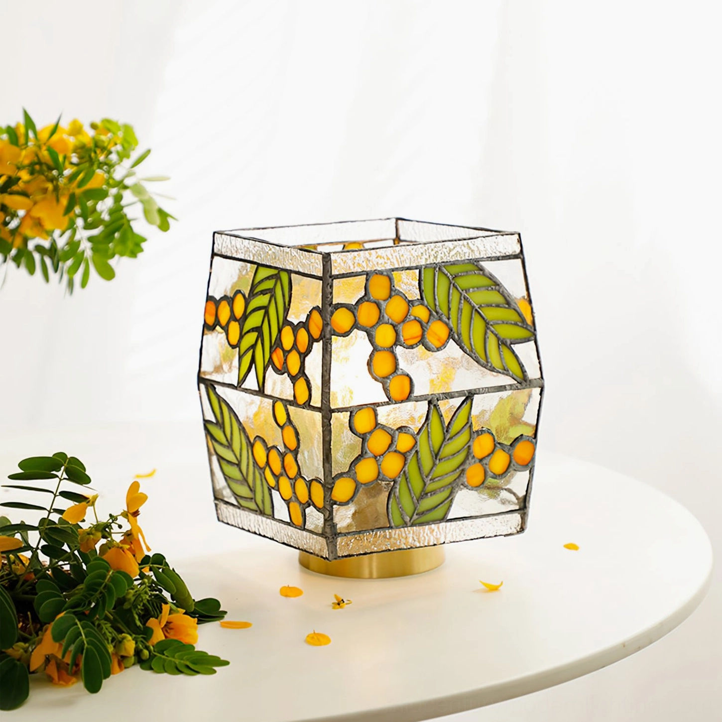 Seed Table Lamp side three-quarter view showing symmetrical stained glass botanical pattern