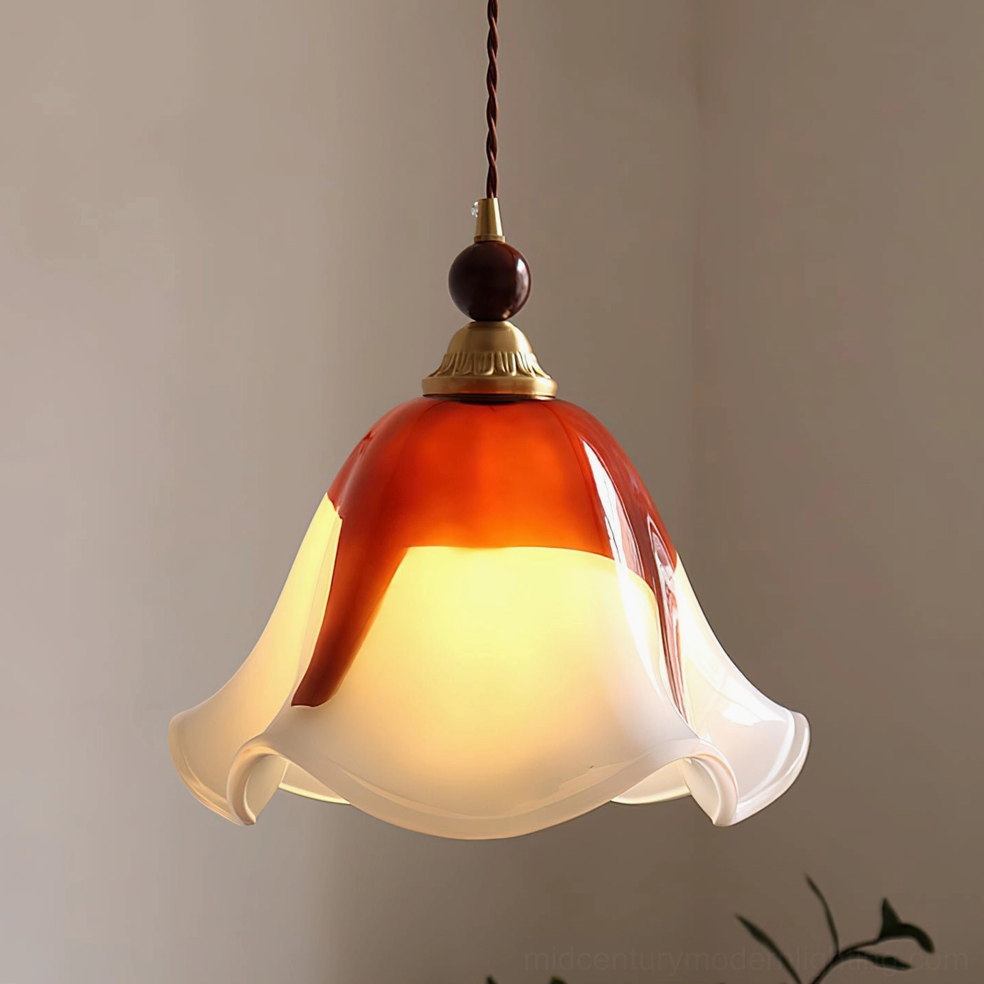 Illuminated Selene pendant light emitting warm ambient glow in contemporary minimalist corner space