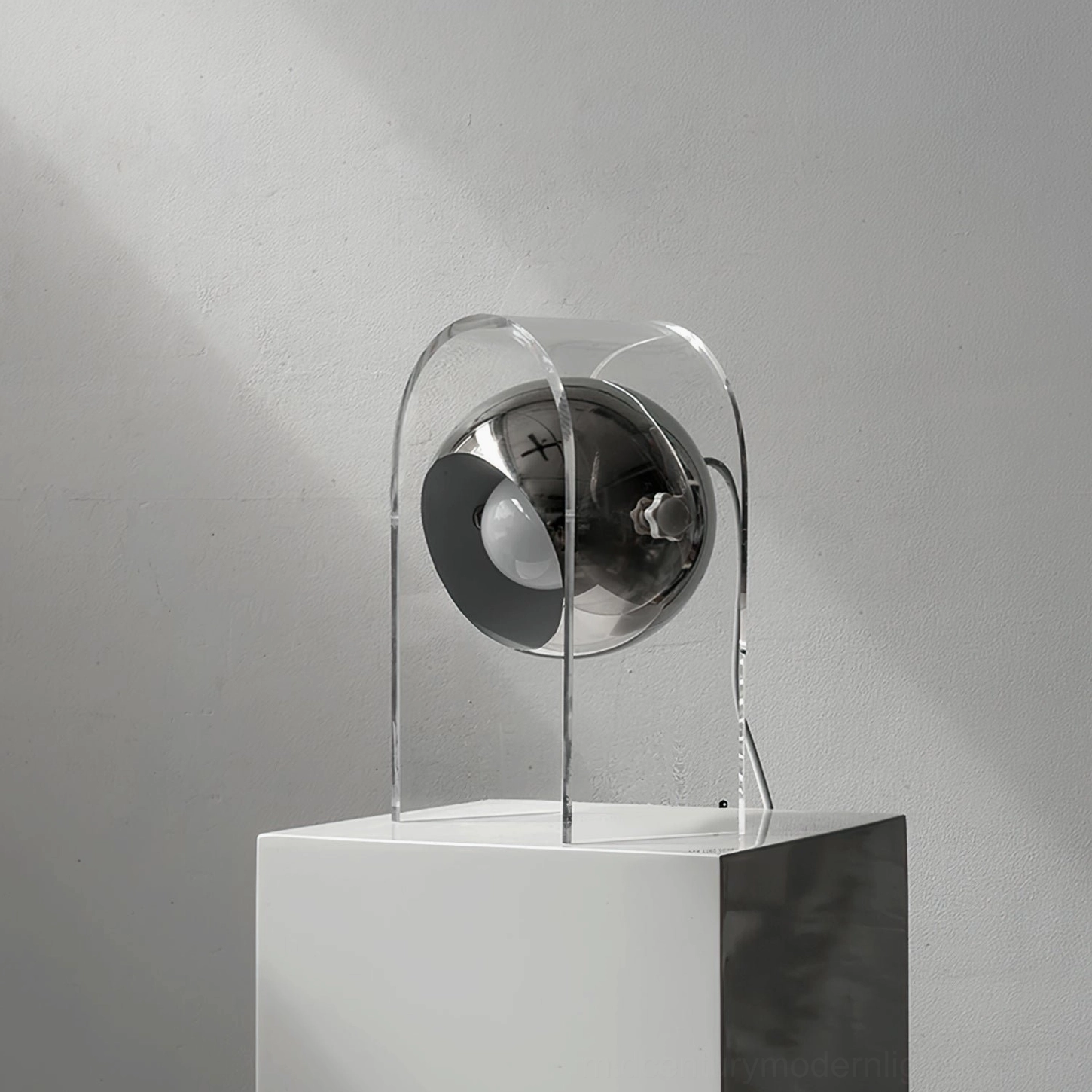 Front close-up of modern desk lamp highlighting metal adjustment knob and chrome components