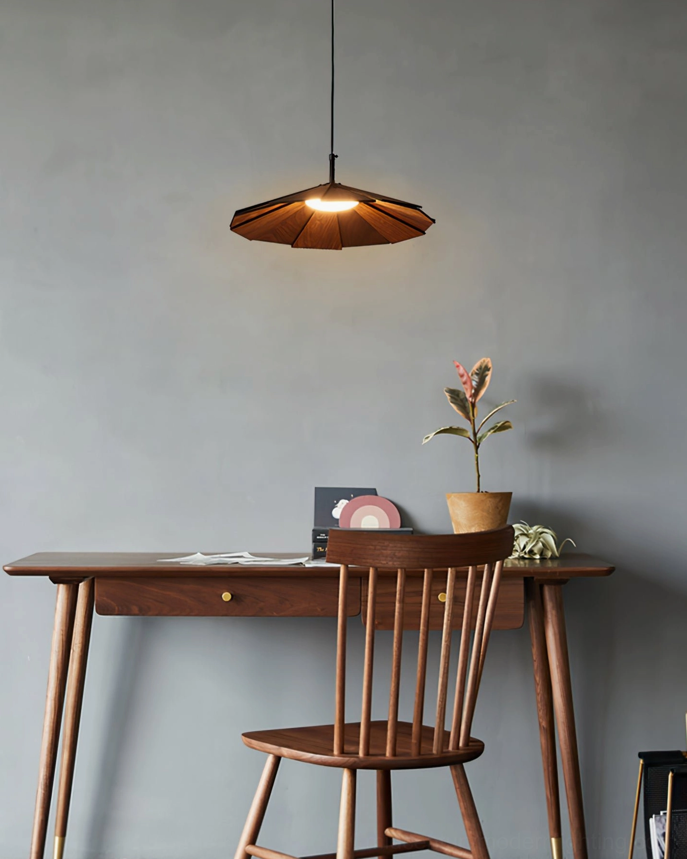 Sepal pendant lamp in entryway foyer installation making architectural statement