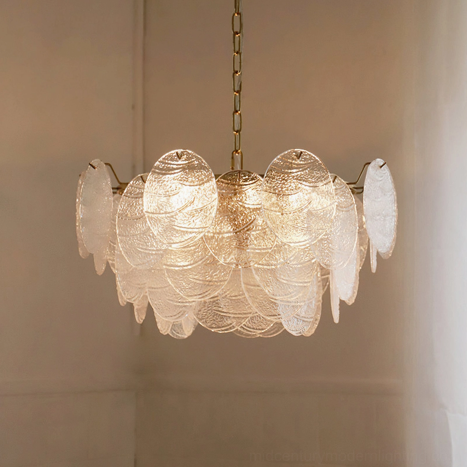 Seraphina Halo Chandelier lit overhead view warm minimalist interior gold metal frame luxury style