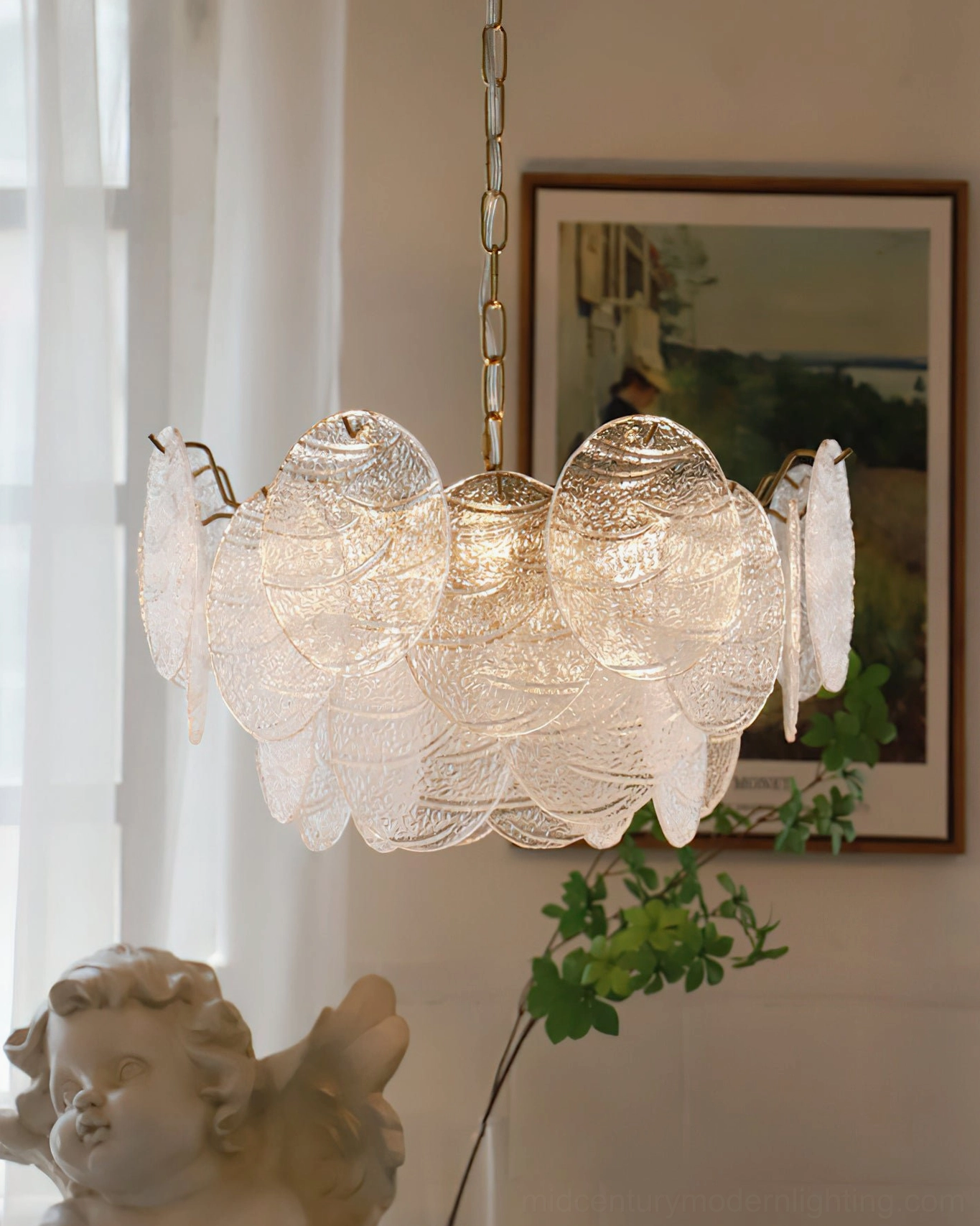 Seraphina Halo Chandelier side three-quarter view showing frosted glass shades and gold hanging hardware