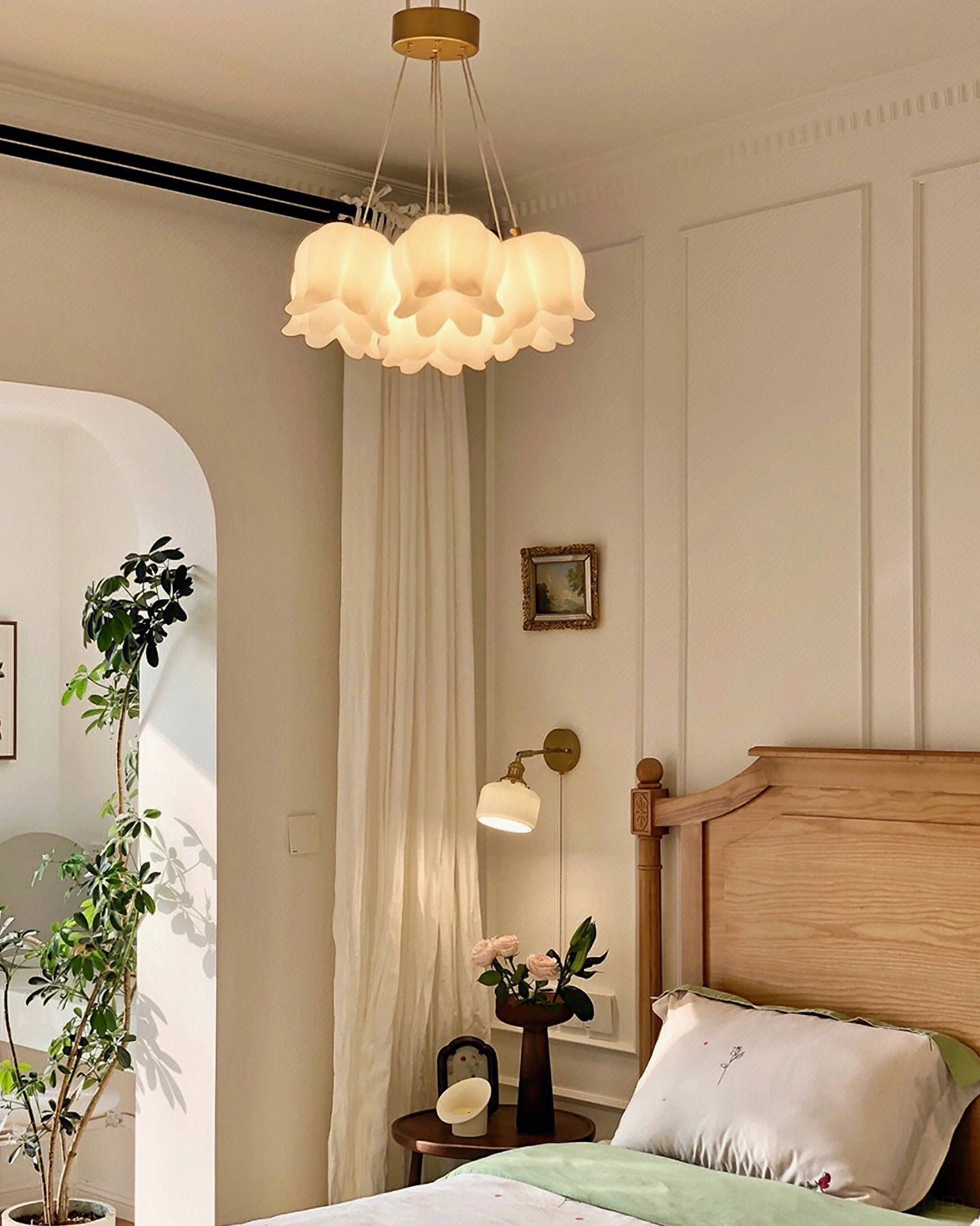 Seven-head lily of the valley pendant chandelier creating warm ambient illumination in mid-century modern interior setting