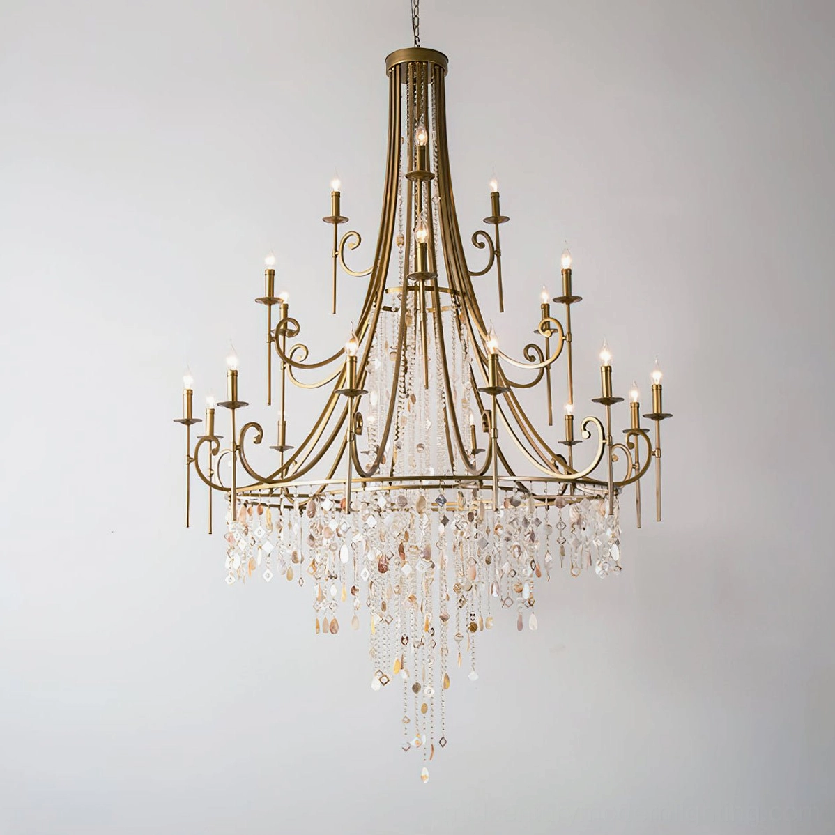Shell Elegance Chandelier gold finish full view with illuminated candle bulbs and dense crystal tassels