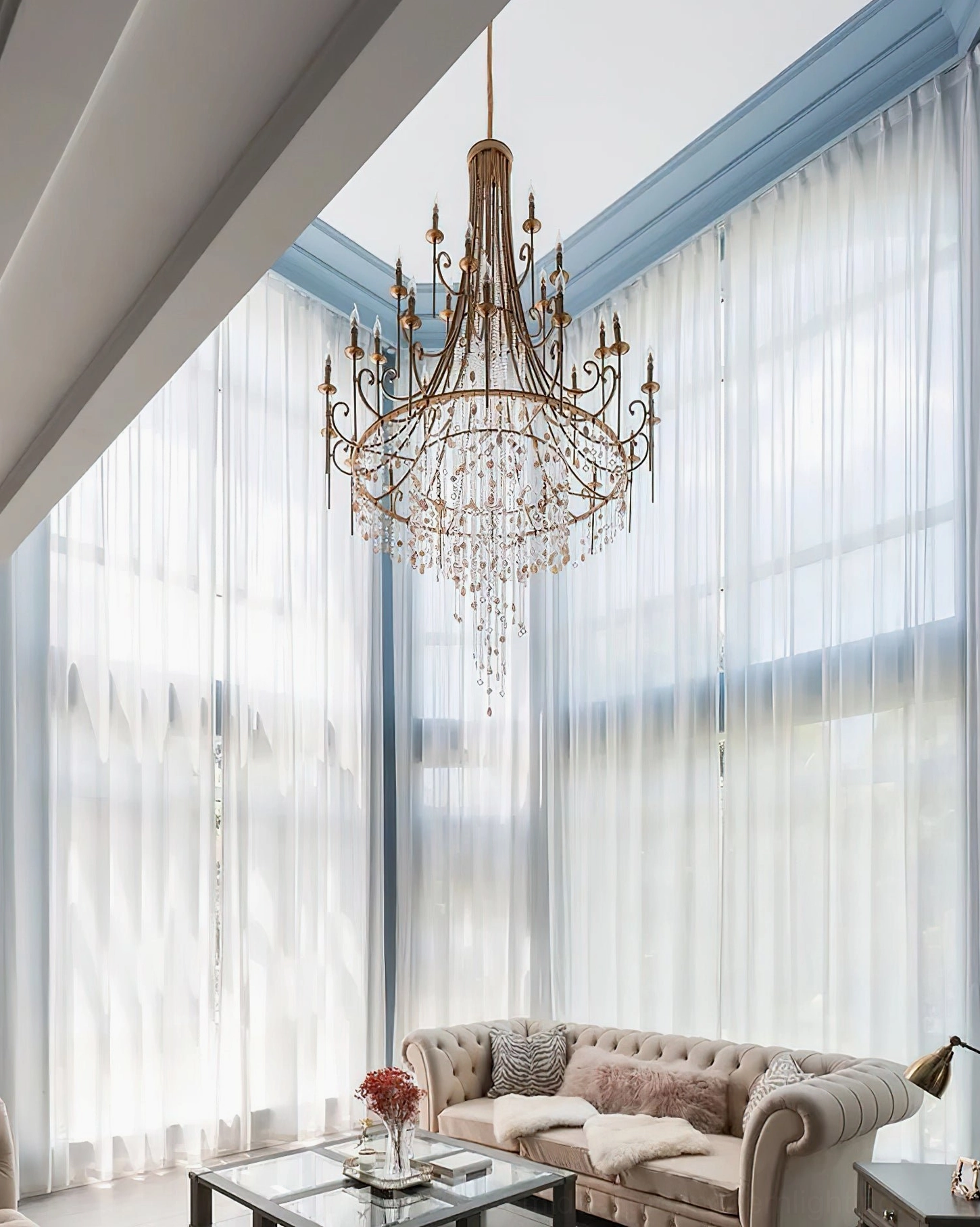 Shell Elegance Chandelier installed in luxury living room with high ceiling, sheer curtains and elegant furnishings